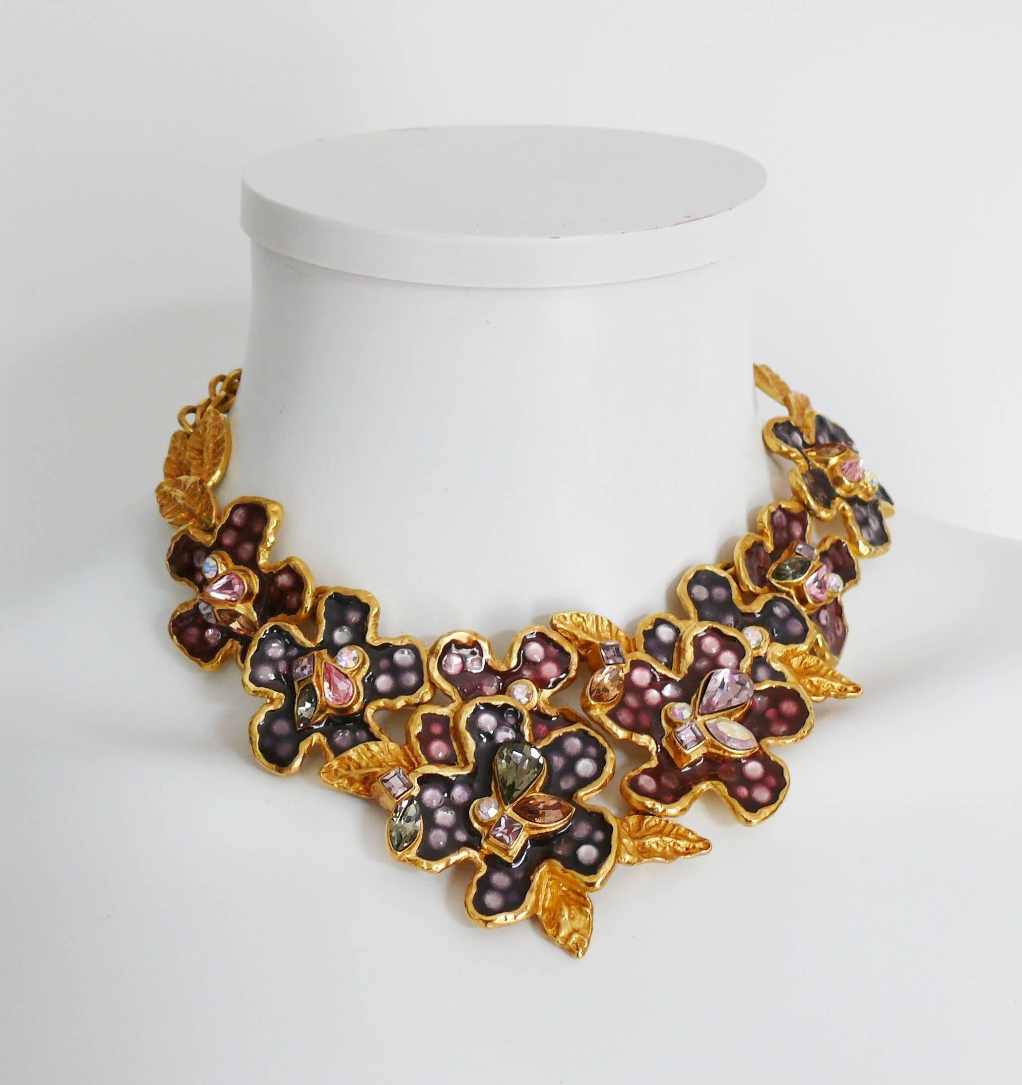 CHRISTIAN LACROIX gorgeous vintage gold toned necklace featuring enameled flowers with multicolor crystal embellishement.

Hook clasp closure.
Extension chain.

Marked CHRISTIAN LACROIX CL Made in France.
CL monogram hanging charm.

Indicative
