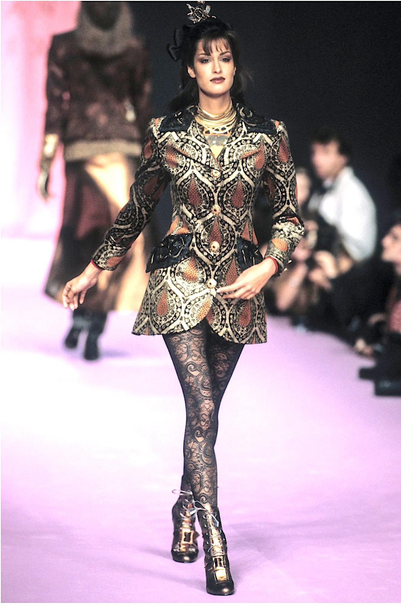 Christian Lacroix Vintage Fall/Winter 1994 Runway Black Evening Jacket
This exquisite vintage Christian Lacroix evening jacket from the Fall/Winter 1994 collection is a masterpiece of luxury and elegance. Embellished with dazzling Goossens jewelry