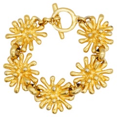 Christian Lacroix Bracciale d'oro vintage con charme a forma di fuochi d'artificio A Link