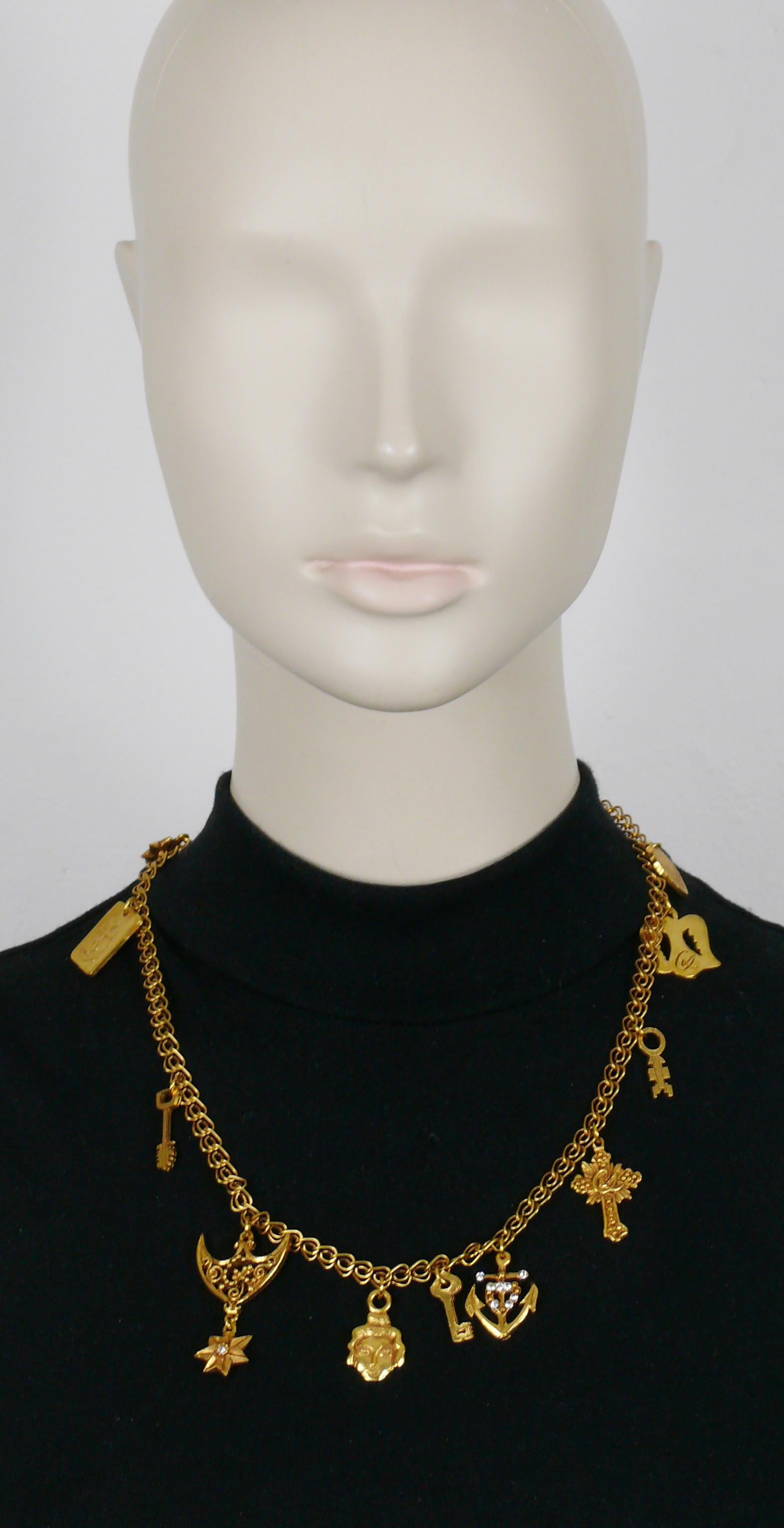 CHRISTIAN LACROIX vintage gold tone charm necklace.

Lobster clasp closure.

Marked CHRISTIAN LACROIX CL Made in France.

Indicative measurements :  length approx. 52 cm (20.47 inches).

Material : Gold tone metal hardware / Crystal.

NOTES
- This