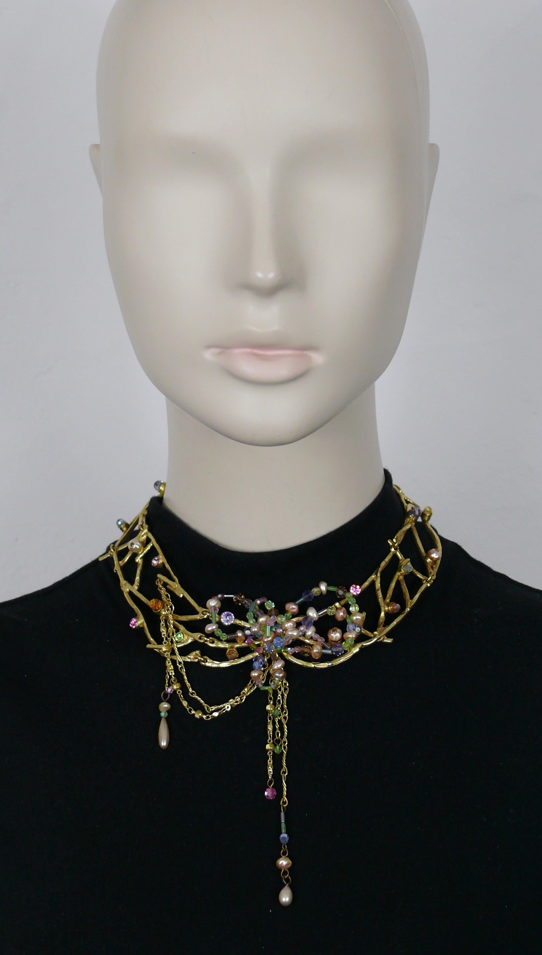 CHRISTIAN LACROIX vintage gold tone choker necklace featuring intertwined jewelled branches and a stylized flower at the center with multicolor beads and faux pearls.

T-bar toggle closure.
Adjustable length.

Marked CHRISTIAN LACROIX CL Made in