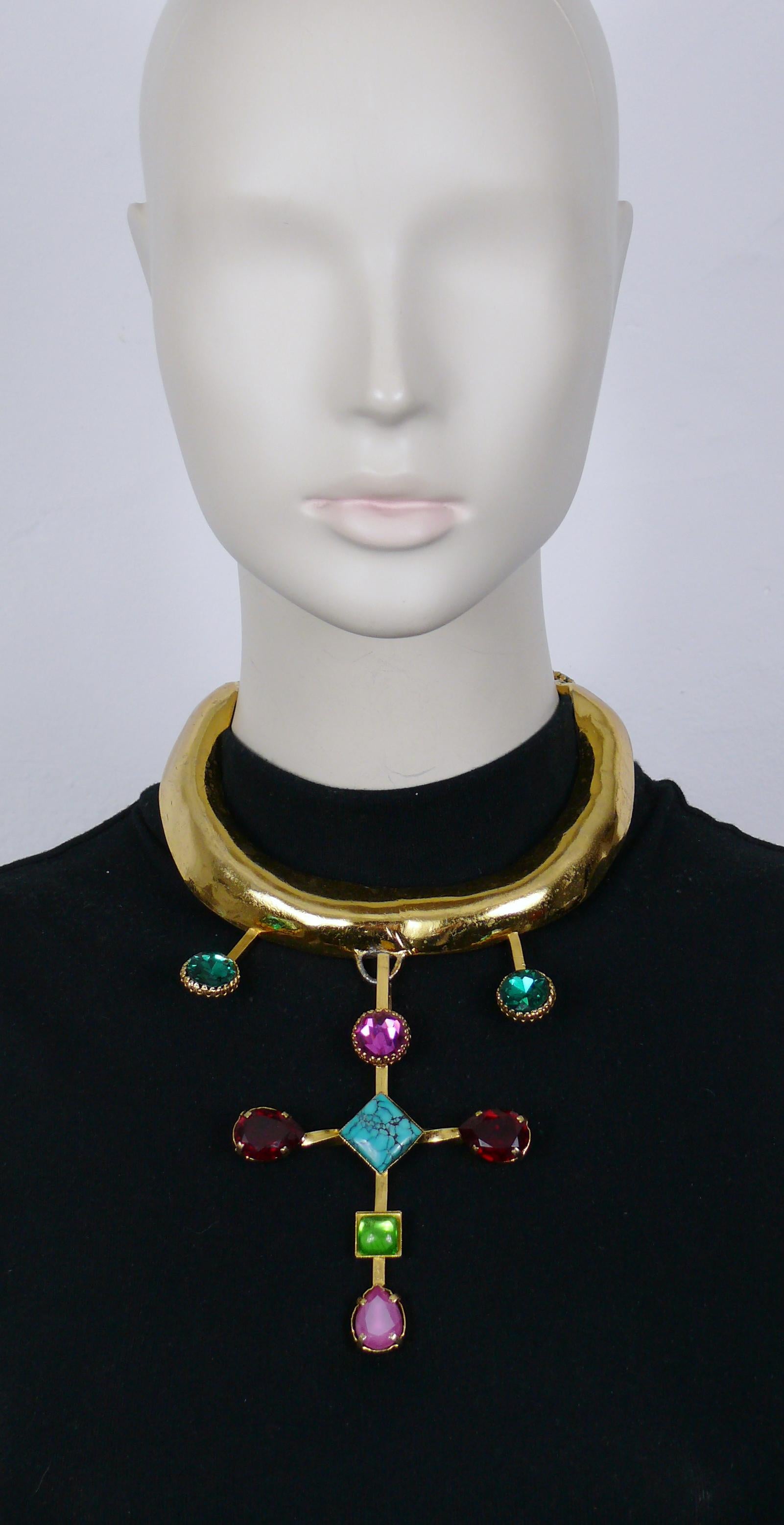 CHRISTIAN LACROIX vintage textured gold tone torque necklace featuring a cross pendant embellished with multicolored crystals, glass and faux turquoise cabochons.

Adjustable hook clasp closure.

Embossed CL Paris.

Indicative measurements : inner
