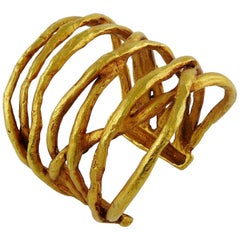 Christian Lacroix - Bracelet manchette vintage en métal doré à motif filaire
