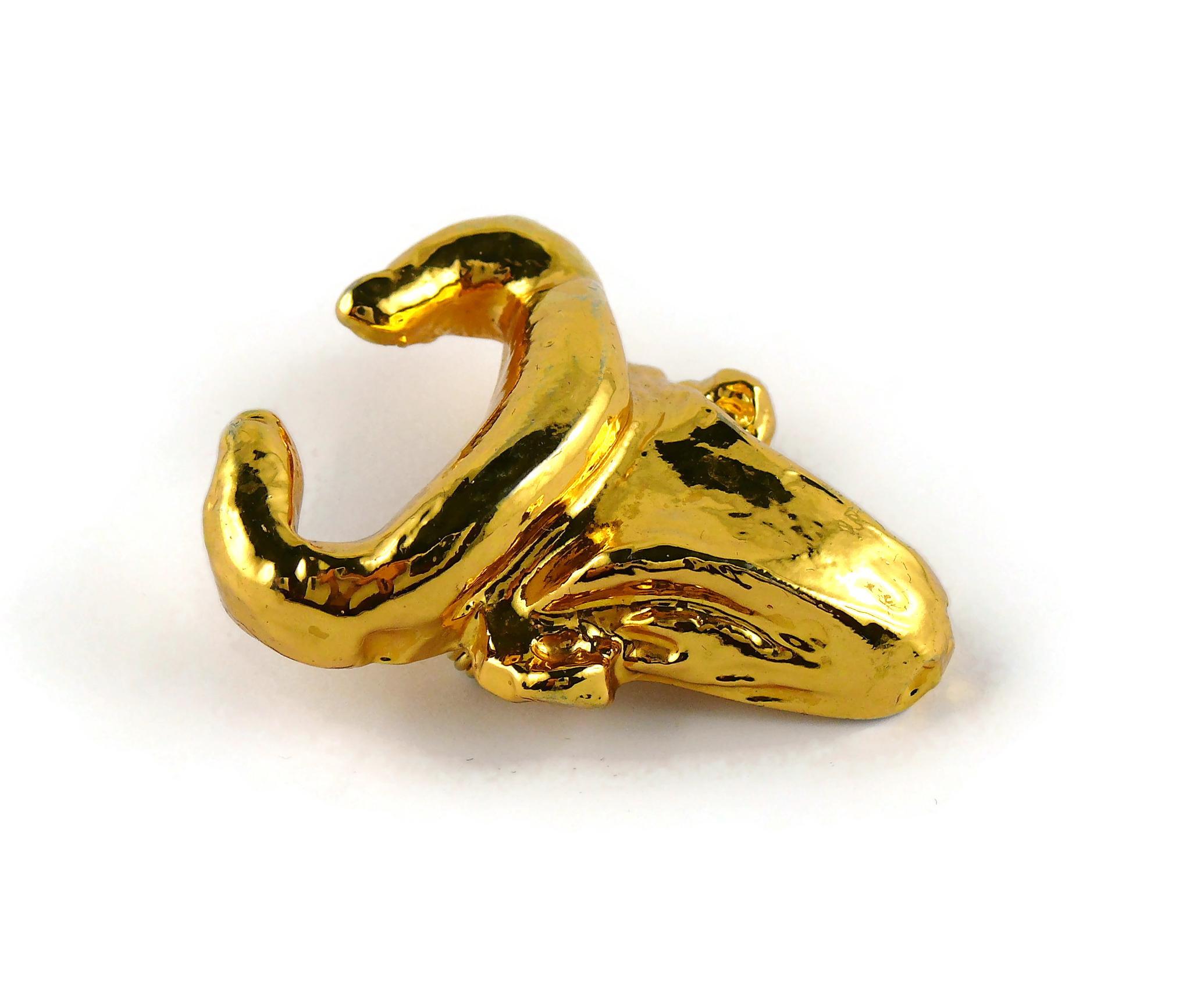 CHRISTIAN LACROIX vintage gold toned resin bull head brooch.

Marked CHRISTIAN LACROIX CL Made in France.

Indicative measurements : max. height approx. 5.2 cm (2.05 inches) / max. width approx. 3.7 cm (1.46 inches).

NOTES
- This is a preloved