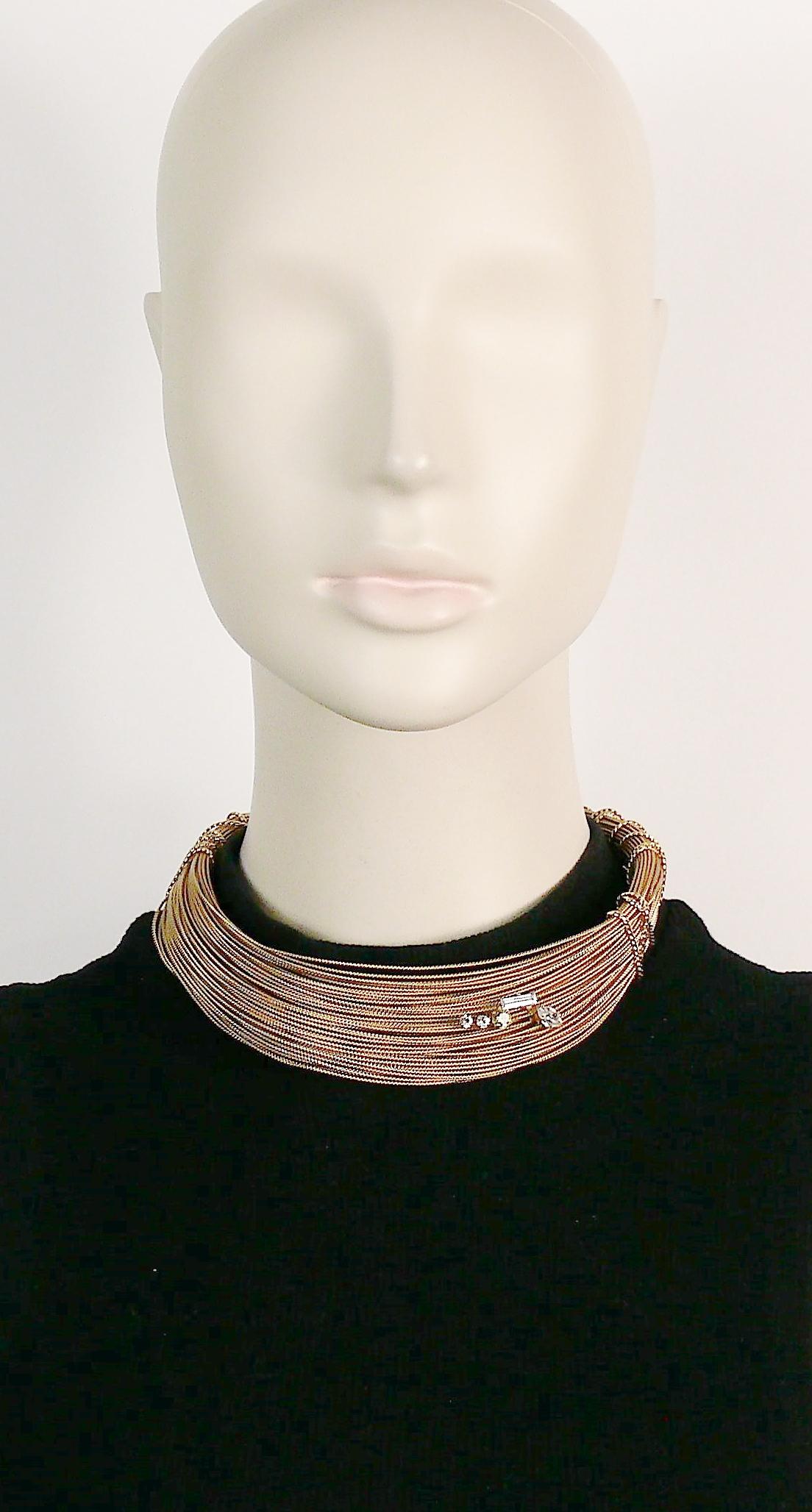CHRISTIAN LACROIX vintage gold toned choker necklace made of bundled textured wires with faceted crystals embellishment.

Embossed CL on the opening.

Indicative measurements : max. height approx. 2.6 cm (1.02 inches).
Adjustable from small to