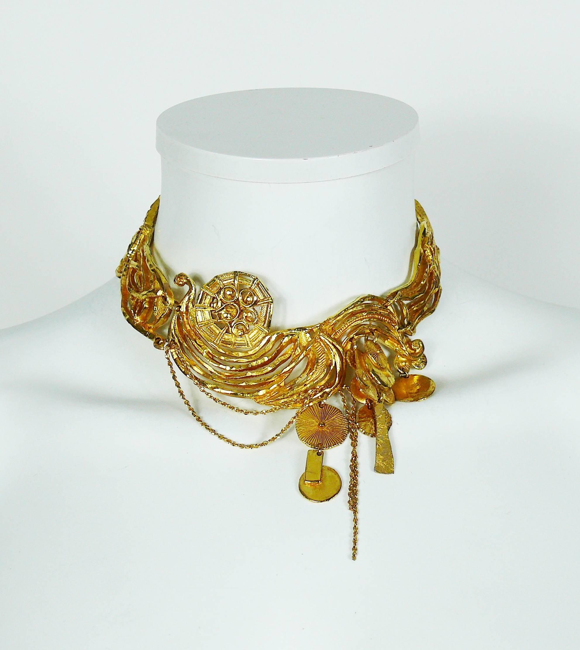 CHRISTIAN LACROIX  gold toned collar necklace featuring a gorgeous openwork design, chains and charms.

Hook clasp closure.
Extension chain.

Marked CHRISTIAN LACROIX CL Made in France.

Indicative measurements : max. circumference approx. 34.24 cm