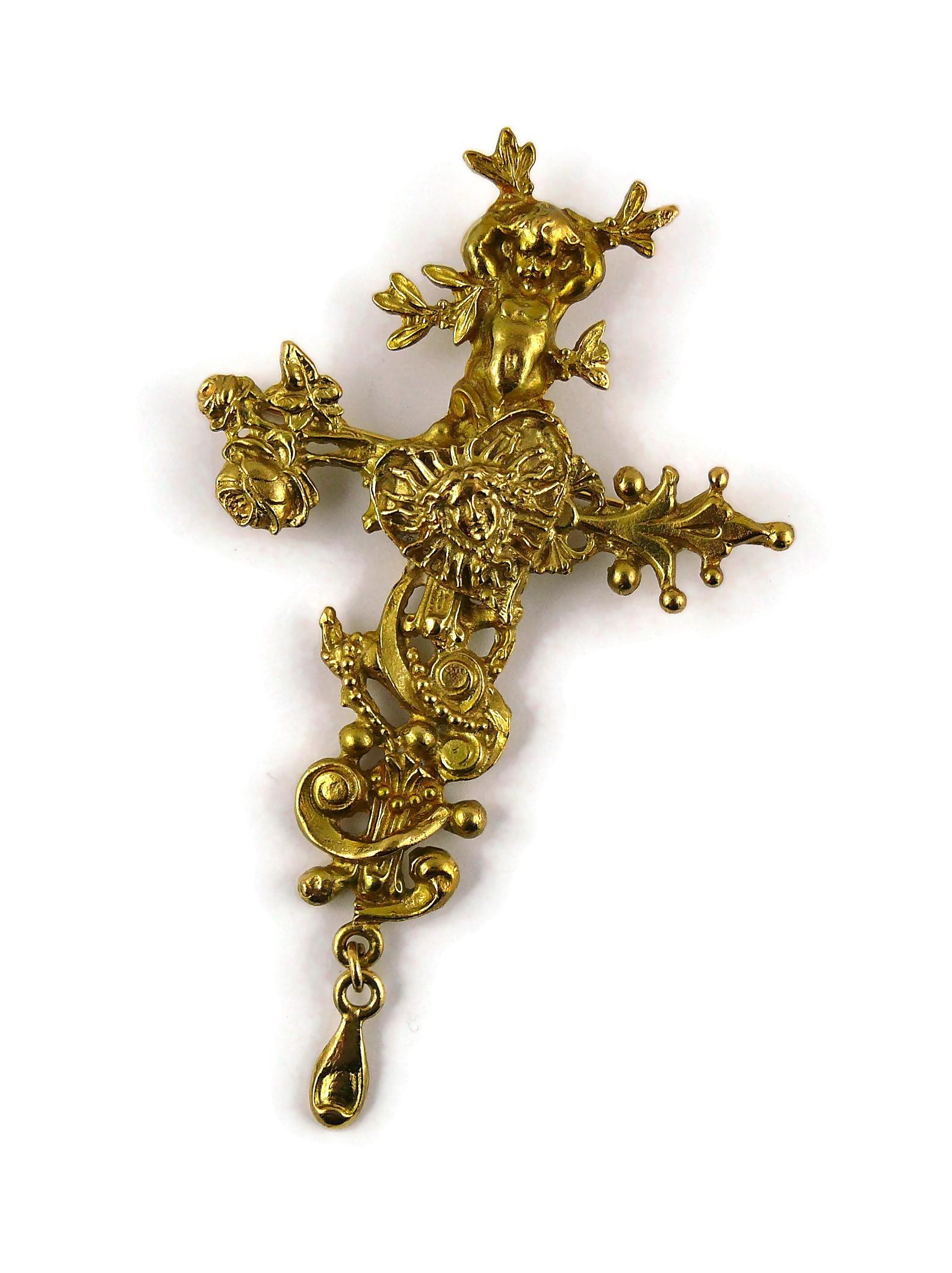 CHRISTIAN LACROIX vintage rare matte gold toned pendant/brooch featuring in a detailed setting a putto, a heart and the allegorical portrait of King Louis XIV founder of the Comedie Francaise.

May be worn as a pendant or brooch.

Marked CHRISTIAN