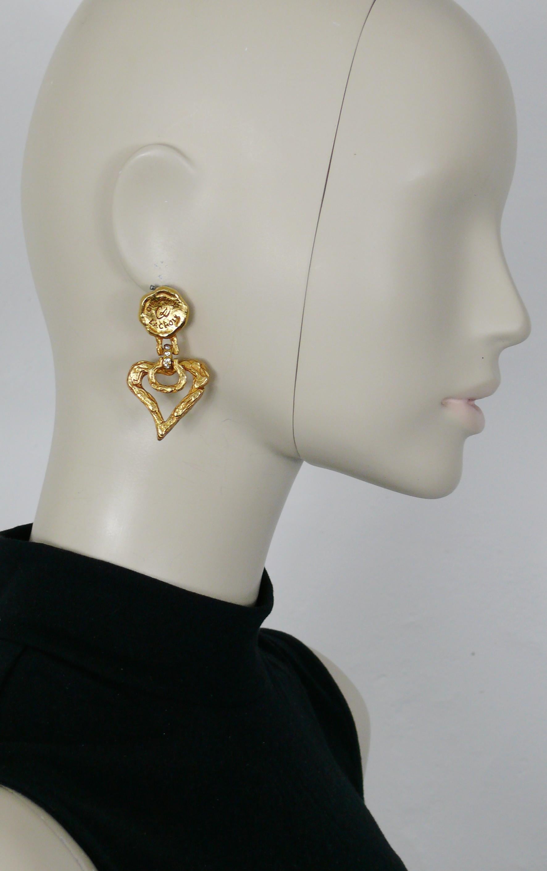 CHRISTIAN LACROIX vintage gold toned door knocker design dangling earrings (clip-on) featuring a textured heart embellished with clear crystal and topped by a seal embossed CHRISTIAN LACROIX CL.

Marked CHRISTIAN LACROIX CL Made in