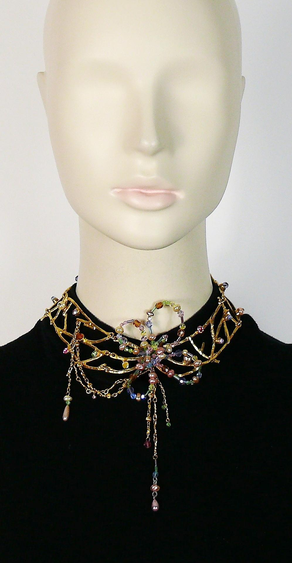 CHRISTIAN LACROIX delicate vintage gold toned choker necklace featuring intertwined jewelled branches and a stylized flower at the center with multicolor beads and faux pearls.

T-bar toggle closure.
Adjustable length.

Marked CHRISTIAN LACROIX CL