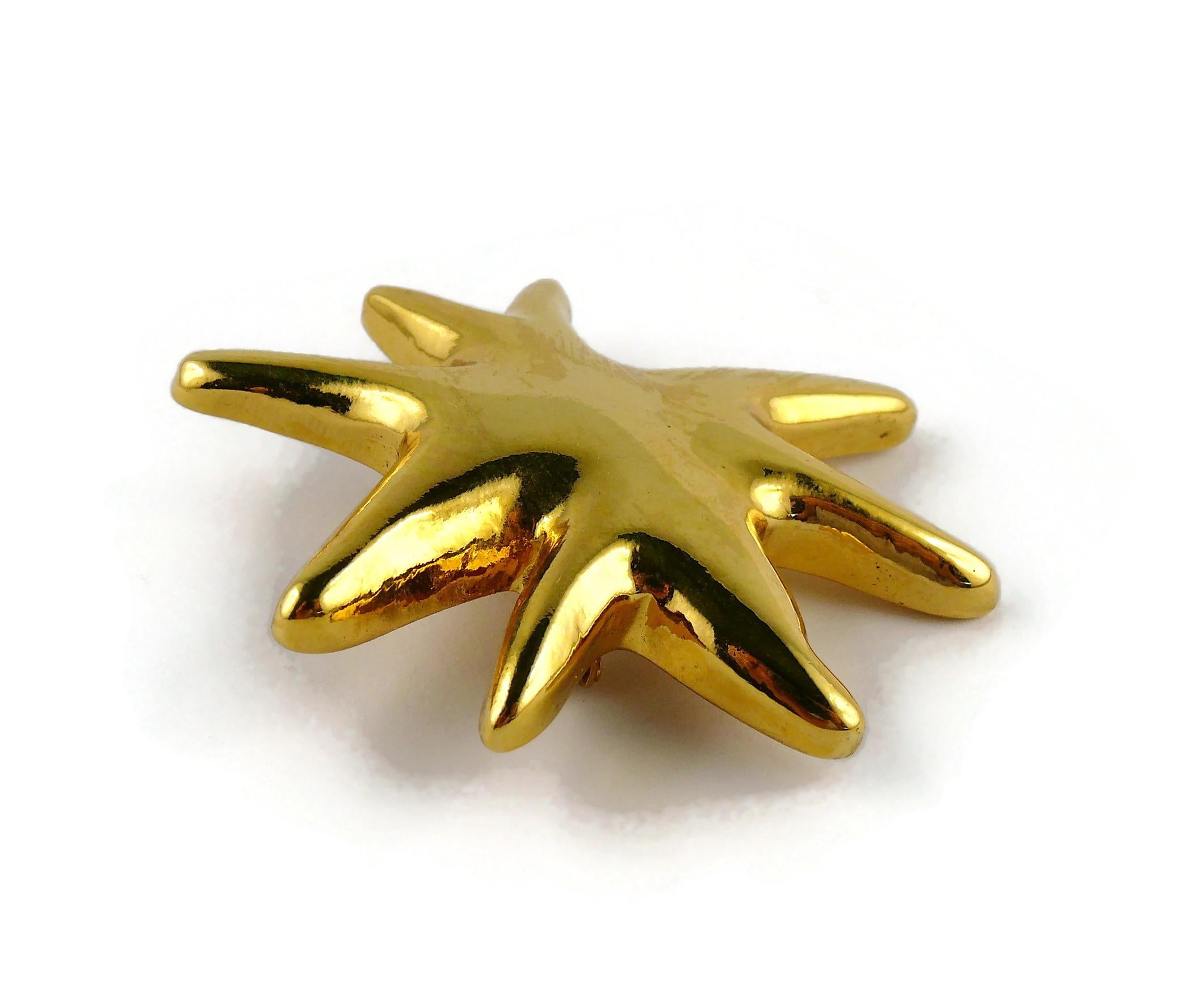 Christian Lacroix Vintage Gold Toned Resin Iconic Starburst Brooch For Sale 1