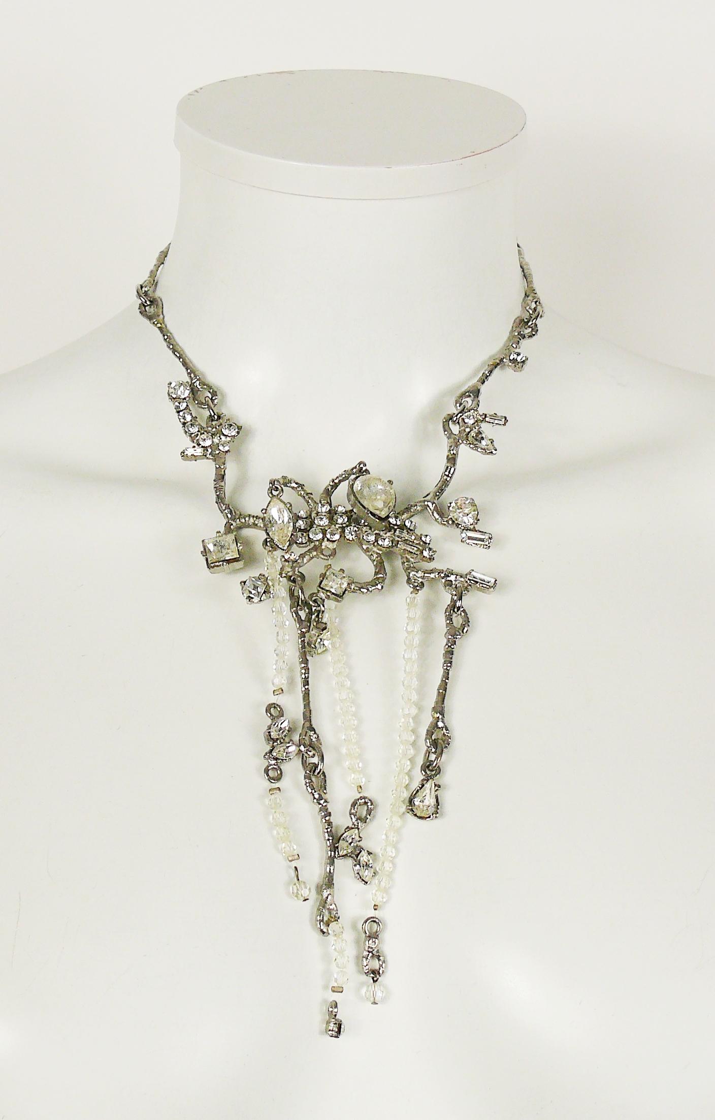 CHRISTIAN LACROIX vintage silver toned necklace featuring branches design embellished with clear crystals and glass beads.

T-bar closure.

Marked CHRISTIAN LACROIX CL Made in France.

Indicative measurements : adjustable length from approx. 35 cm