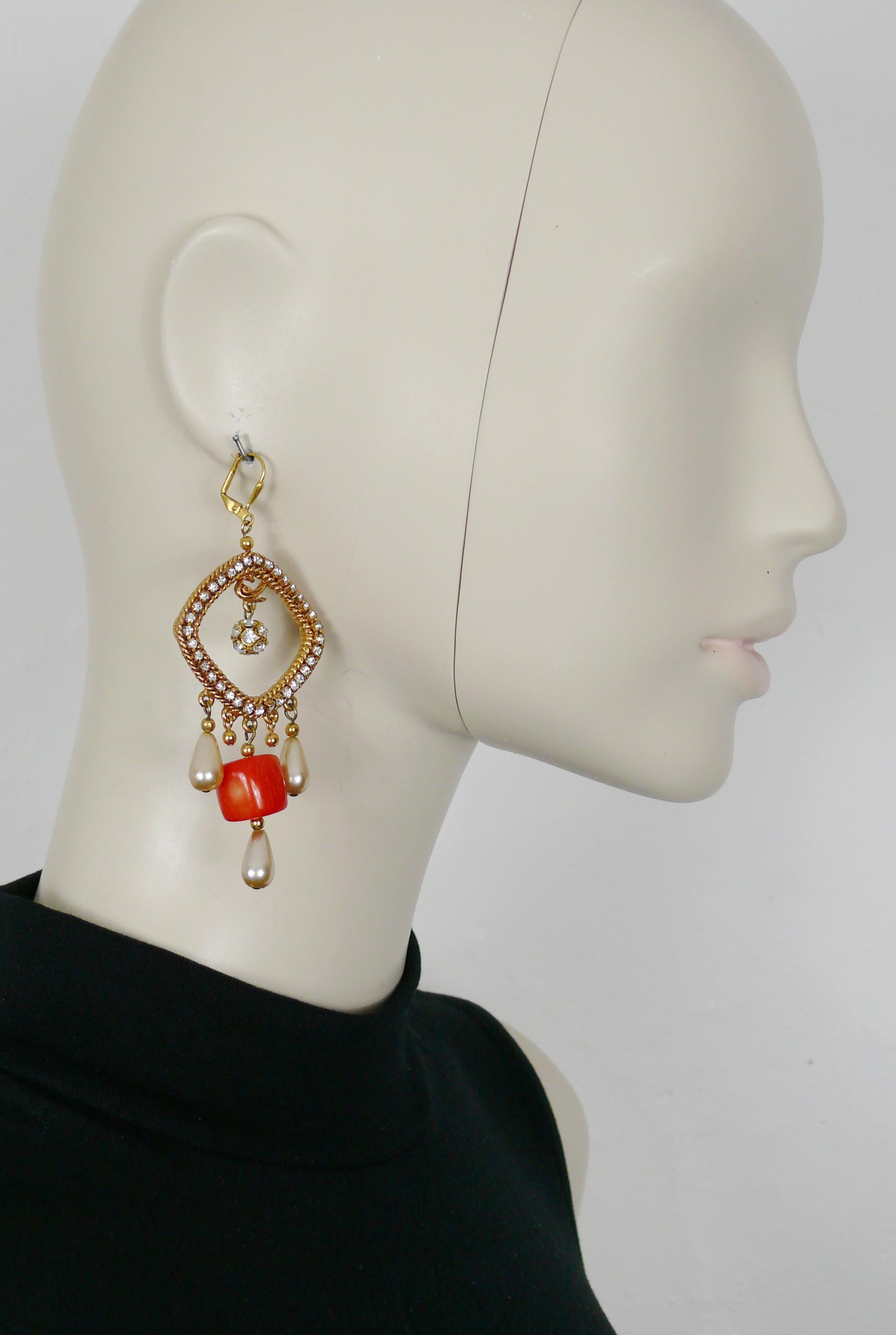 CHRISTIAN LACROIX vintage gold toned dangling earrings (for pierced ears) embellished with clear crystals, crystal ball, faux pearls and a large irregular shaped cylindrical red glass bead.

CL monogram on each earring.

Unmarked.

Indicative