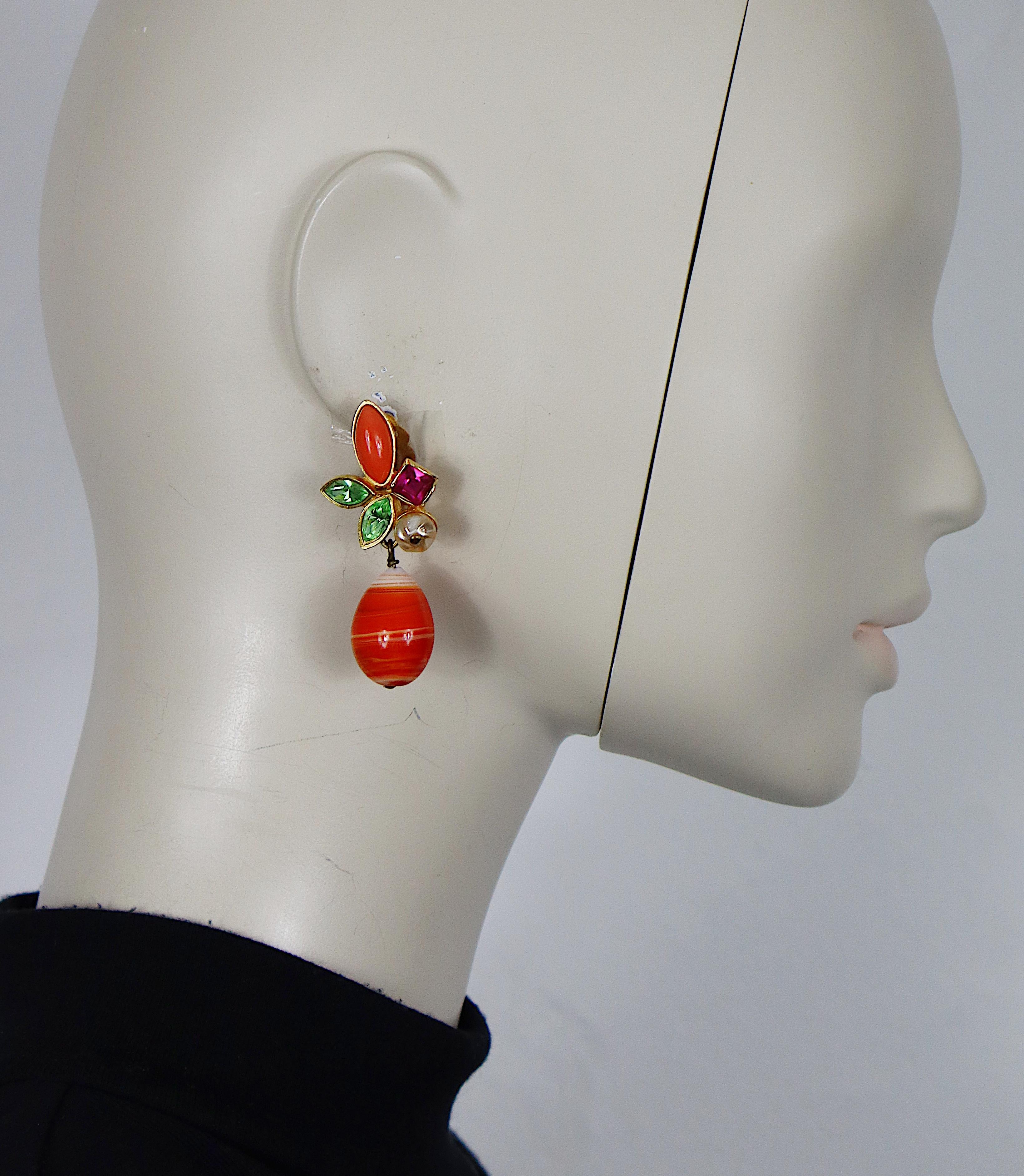 CHRISTIAN LACROIX vintage dangling earrings (clip-on) embellished with multicolored crystals, glass cabochon, faux pearl and a large pate de verre drop.

Marked CHRISTIAN LACROIX CL Made in France.

Indicative measurements : max. height approx. 5.5