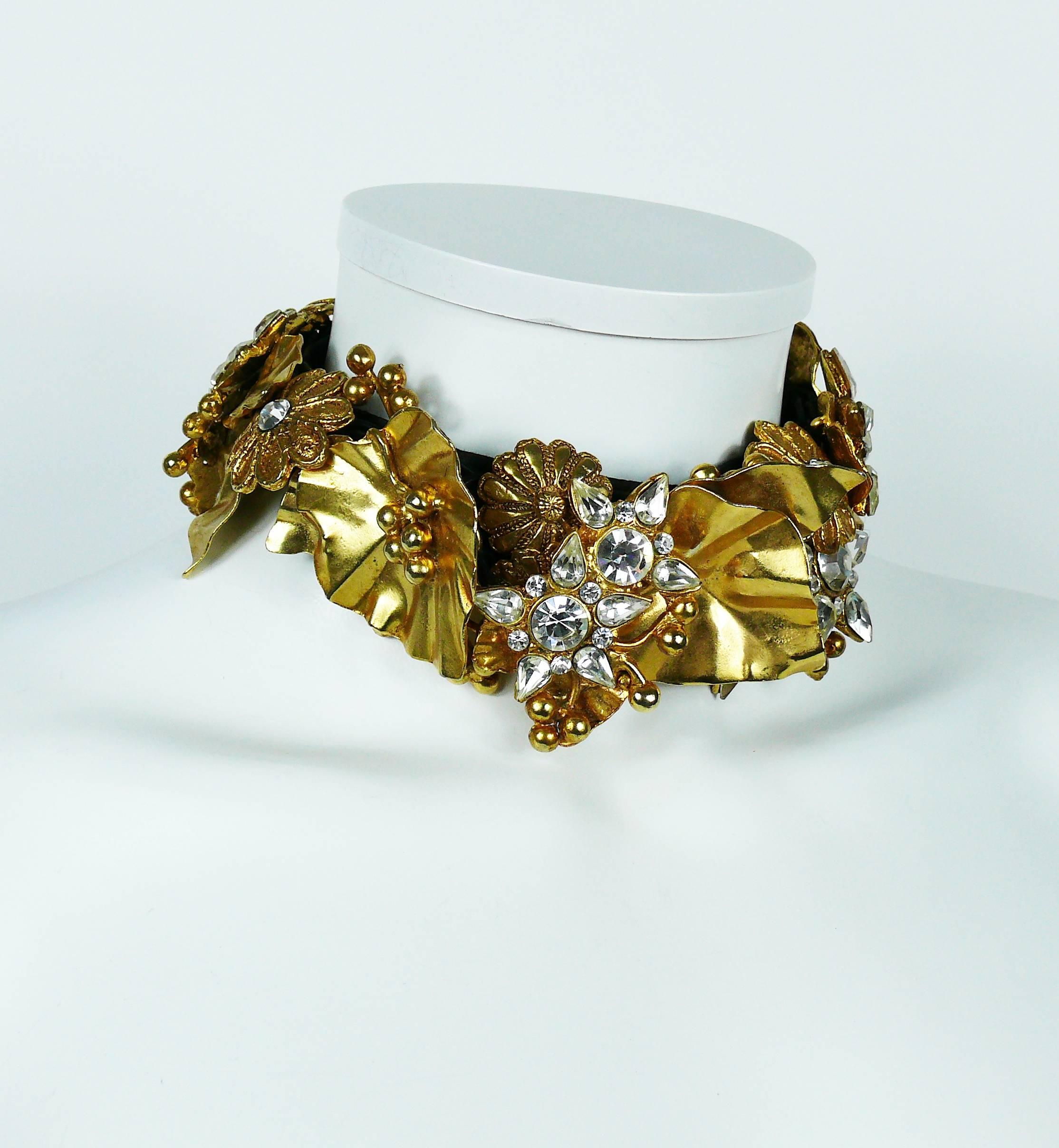 CHRISTIAN LACROIX vintage choker featuring gold toned floral elements embellished with clear crystals.

Each element is sewn on a black passementerie strap.
Elements are dangling to ensure flexibility around neck.

Hook clasp.
Extension