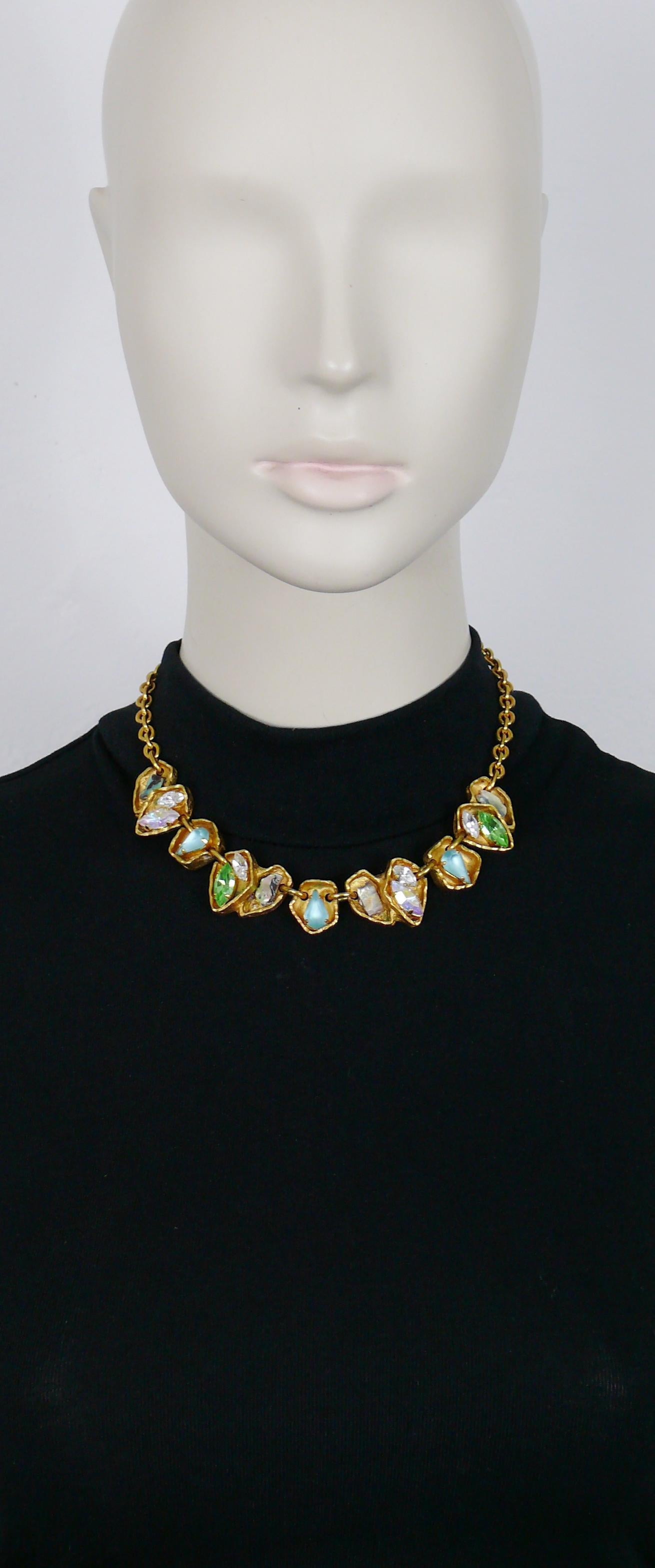 CHRISTIAN LACROIX vintage gold toned necklace featuring freeform links embellished with multicolored crystals and iridescent stones.

T-bar and toggle closure.

Marked CHRISTIAN LACROIX CL Made in France.

Indicative measurements : max. length