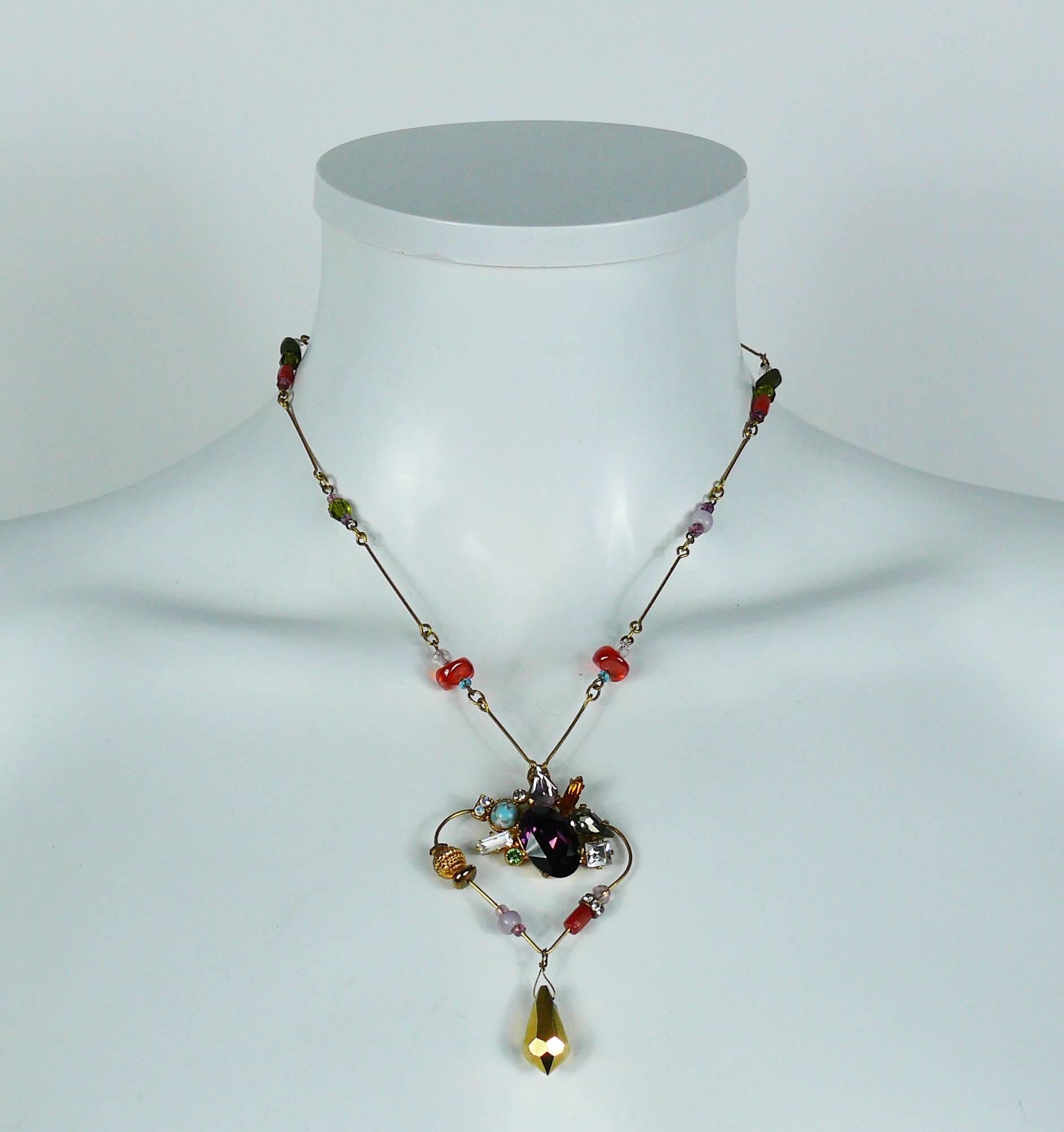 CHRISTIAN LACROIX vintage heart pendant necklace embellished with faux turquoise, glass pearls, multicolored crystals and gold tone faceted glass drop.

Marked CHRISTIAN LACROIX CL Made in France.

Indicative measurements : adjustable length from