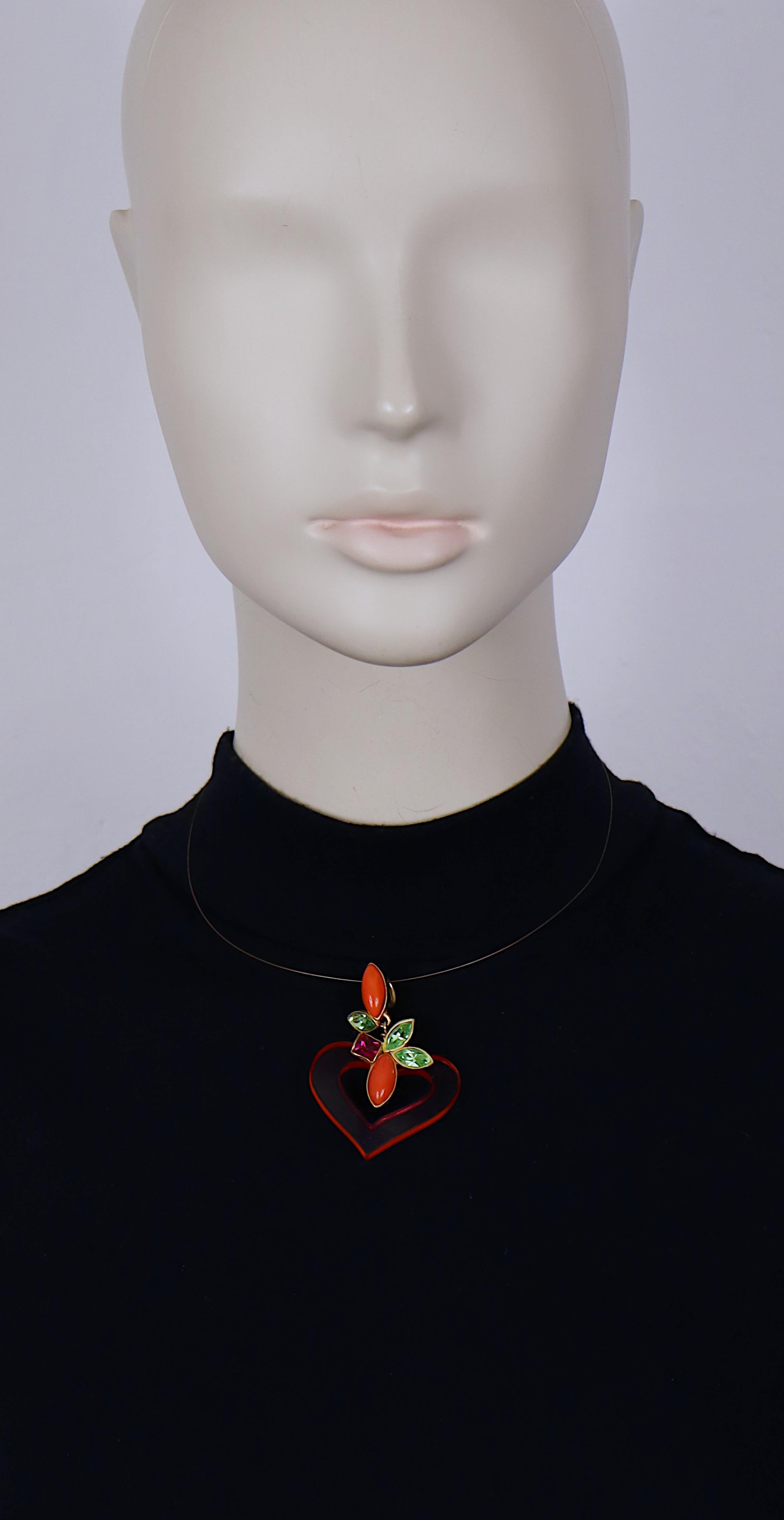CHRISTIAN LACROIX vintage brass wire necklace featuring a pink perspex heart pendant embellished with multicolor crystals and coral color resin cabochons.

Embossed CHRISTIAN LACROIX CL Made in France on the reverse of the pendant.
CL hanging