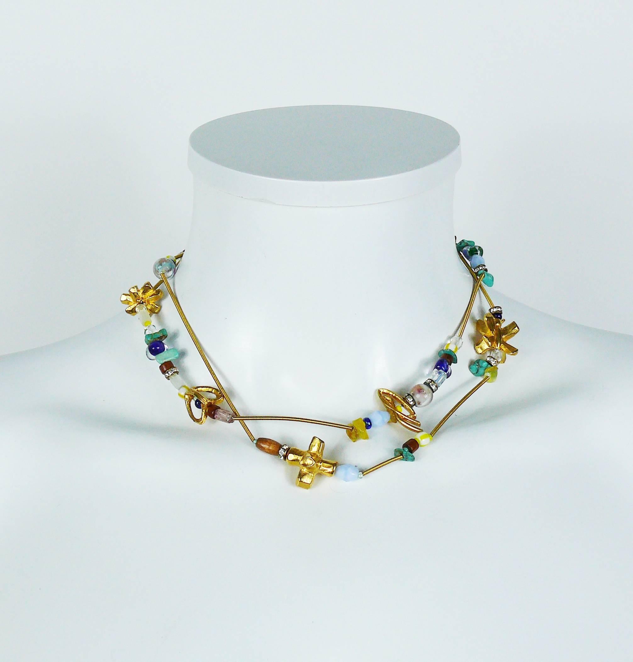 CHRISTIAN LACROIX vintage two strand gold toned necklace featuring glass beads, faux turquoises and crystal rondelles embellishement.

Marked CHRISTIAN LACROIX CL Made in France.

Indicative measurements : max. length approx. 39.5 cm (15.55 inches)