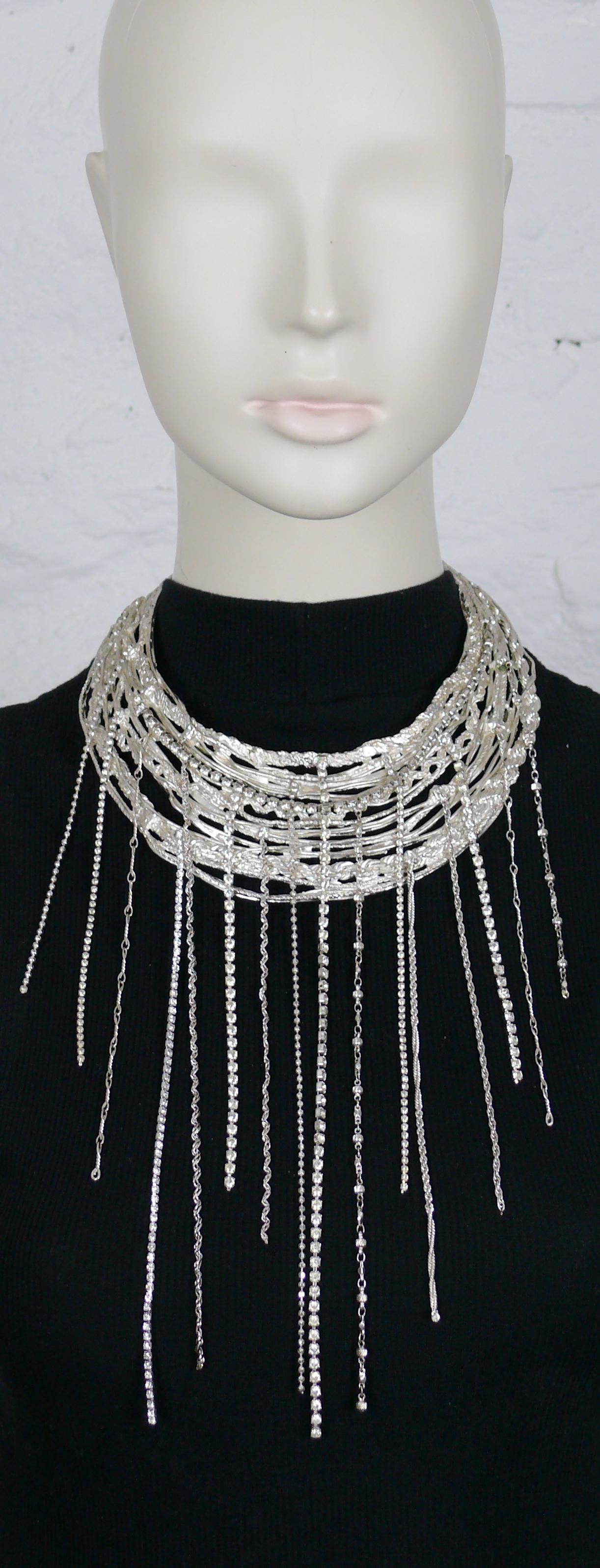 CHRISTIAN LACROIX vintage opulent silver toned bib necklace embellished with a rain of clear crystals and chains.

Silver tone metal hardware.

Adustable hook clasp closure.

Marked CHRISTIAN LACROIX CL Made in France.

Indicative measurements :