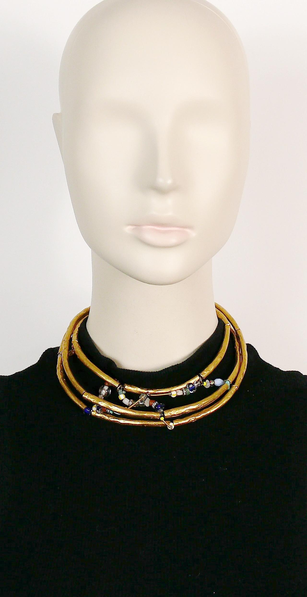 CHRISTIAN LACROIX vintage gold toned choker necklace featuring hammered rigid tubular sections embellished with glass beads, turquoise chips and clear crystal rondelles.

Hook clasp closure.

Marked CHRISTIAN LACROIX CL Made in France.

Indicative