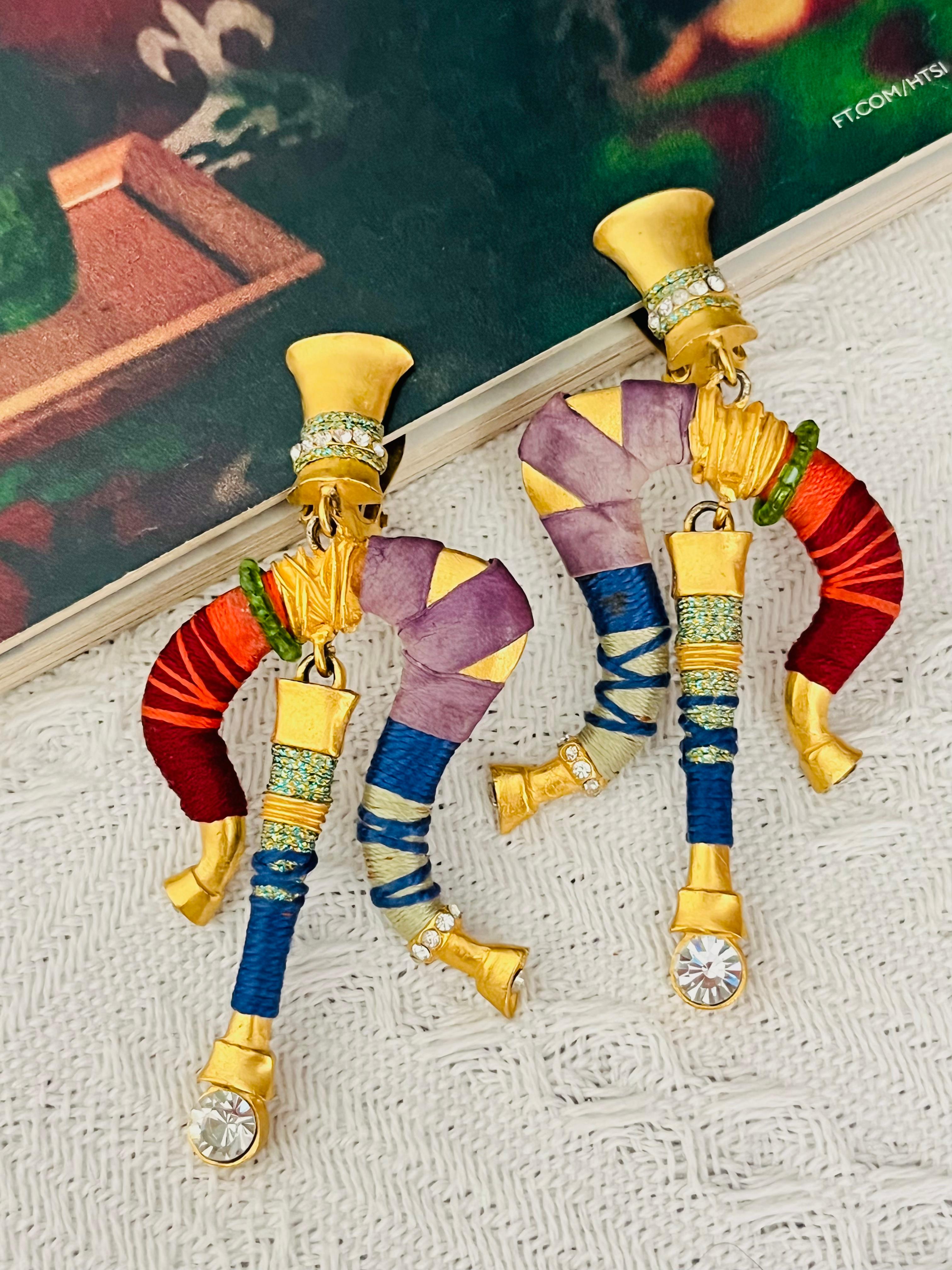 Christian Lacroix Vintage 1980s Masai Crystals Beads Threads Leather Red Navy Blue Green Purple Orange Drop Dangle Chunky Elegant Modernist Clip Earrings, Gold Tone

Very good condition. Light scratches or colour loss, barely noticeable. 100%
