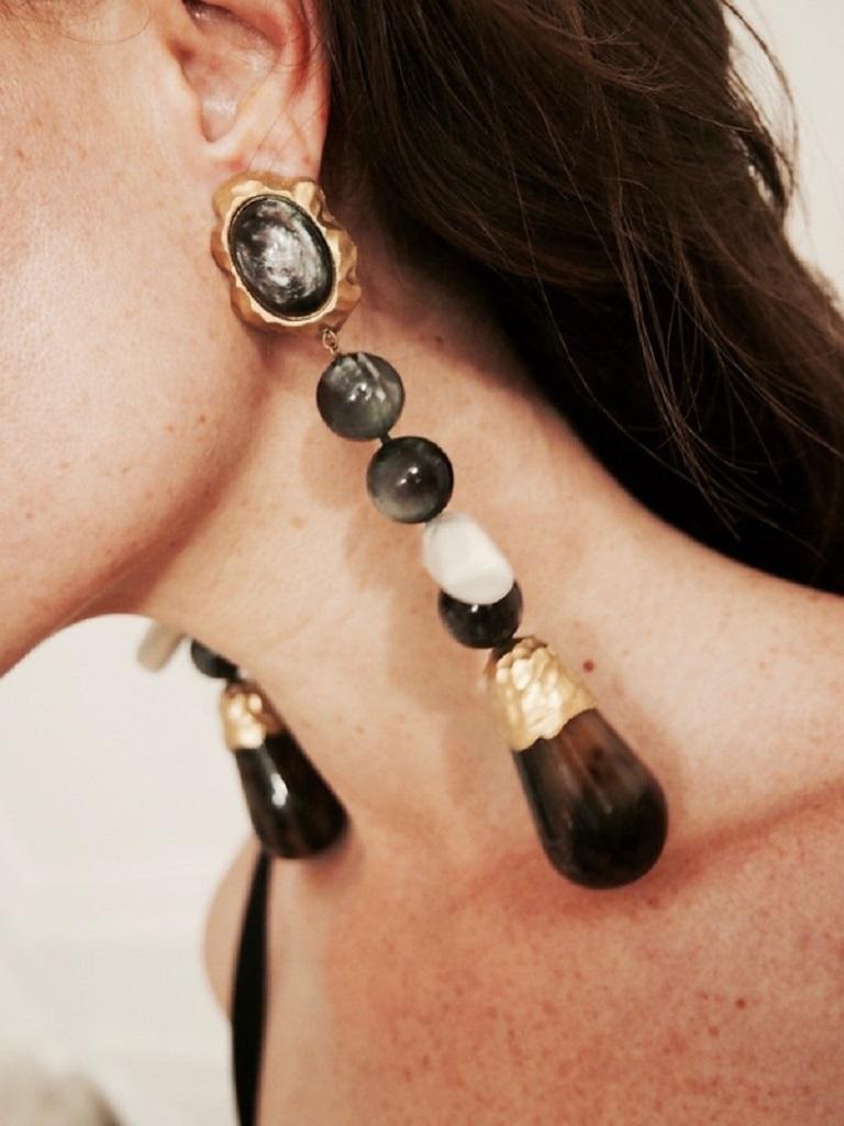 CHRISTIAN LACROIX vintage gold toned massive extra long dangling earrings (clip-on) featuring iridescent resin beads, a large faux horn drop and a white resin 