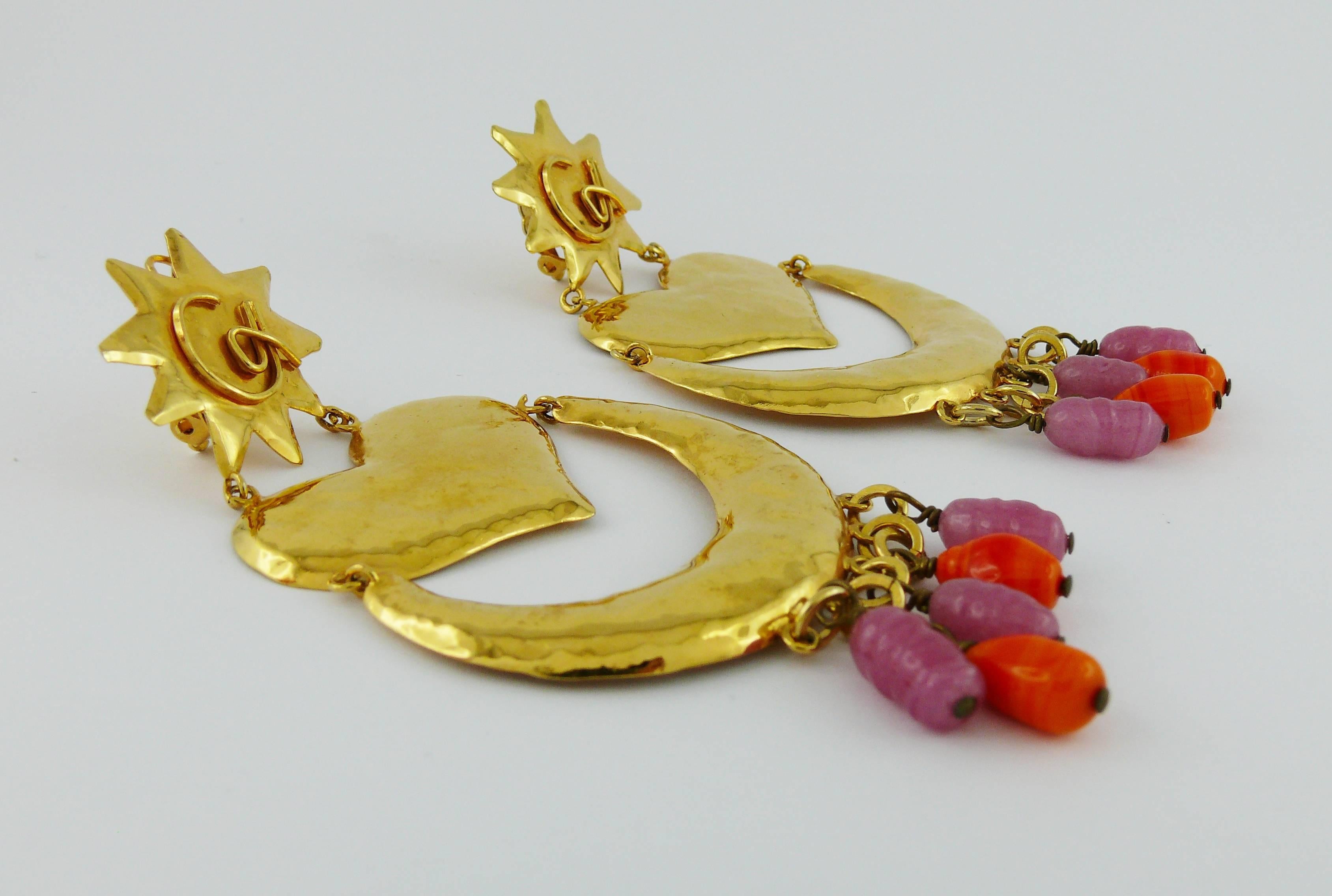 CHRISTIAN LACROIX vintage massive dangling earrings (clip-on) featuring hammered gold toned elements (sun, heart, crescent moon) and glass bead drops.

Marked CHRISTIAN LACROIX CL Made in France.

Indicative measurements : length approx. 10.5 cm