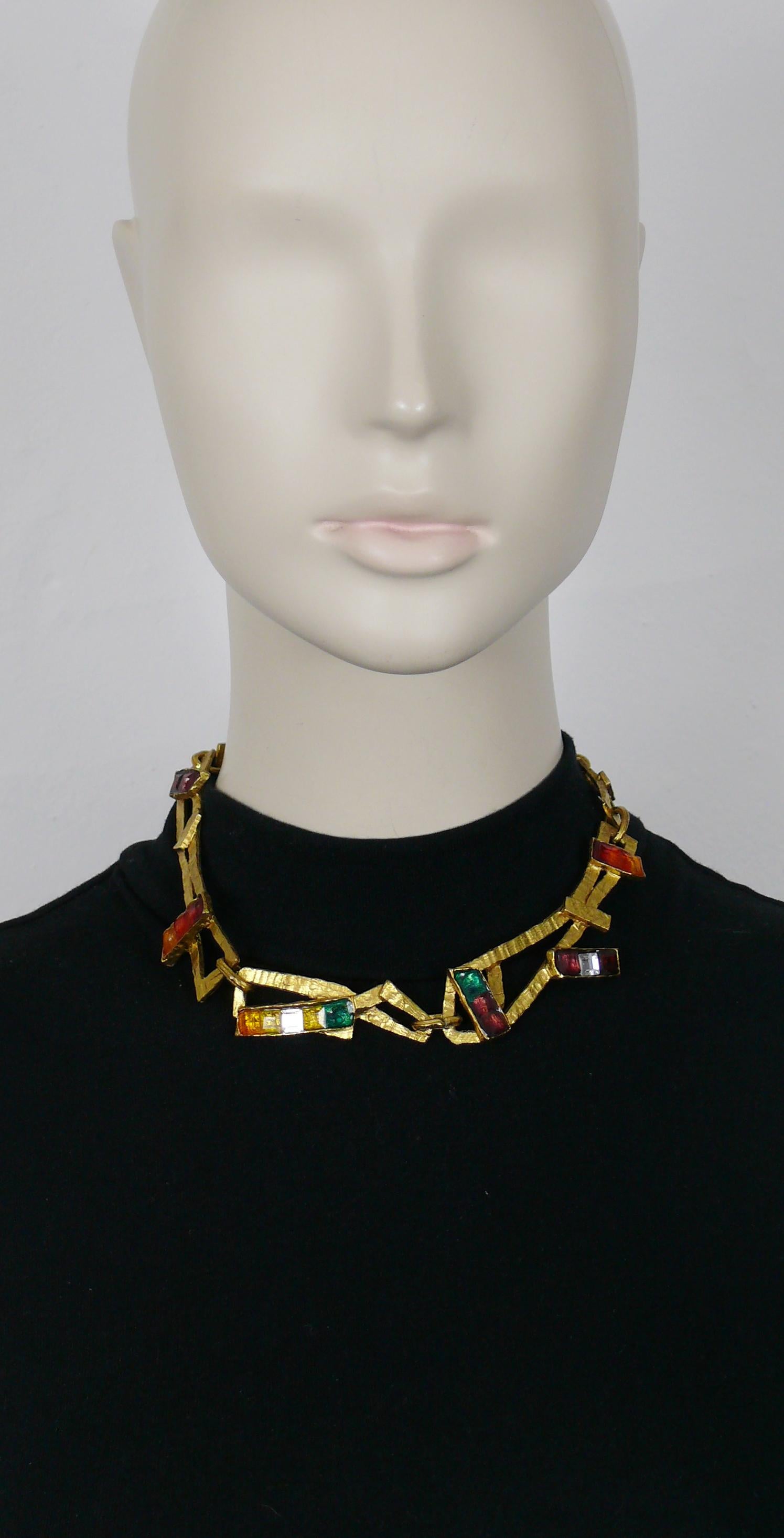 CHRISTIAN LACROIX vintage gold tone necklace featuring textured free form links embellished with multicolor crystals.

CHRISTIAN LACROIX Rainbow Collection.

T-bar and toggles closure.
Adjustable length.

Marked CHRISTIAN LACROIX CL Made in