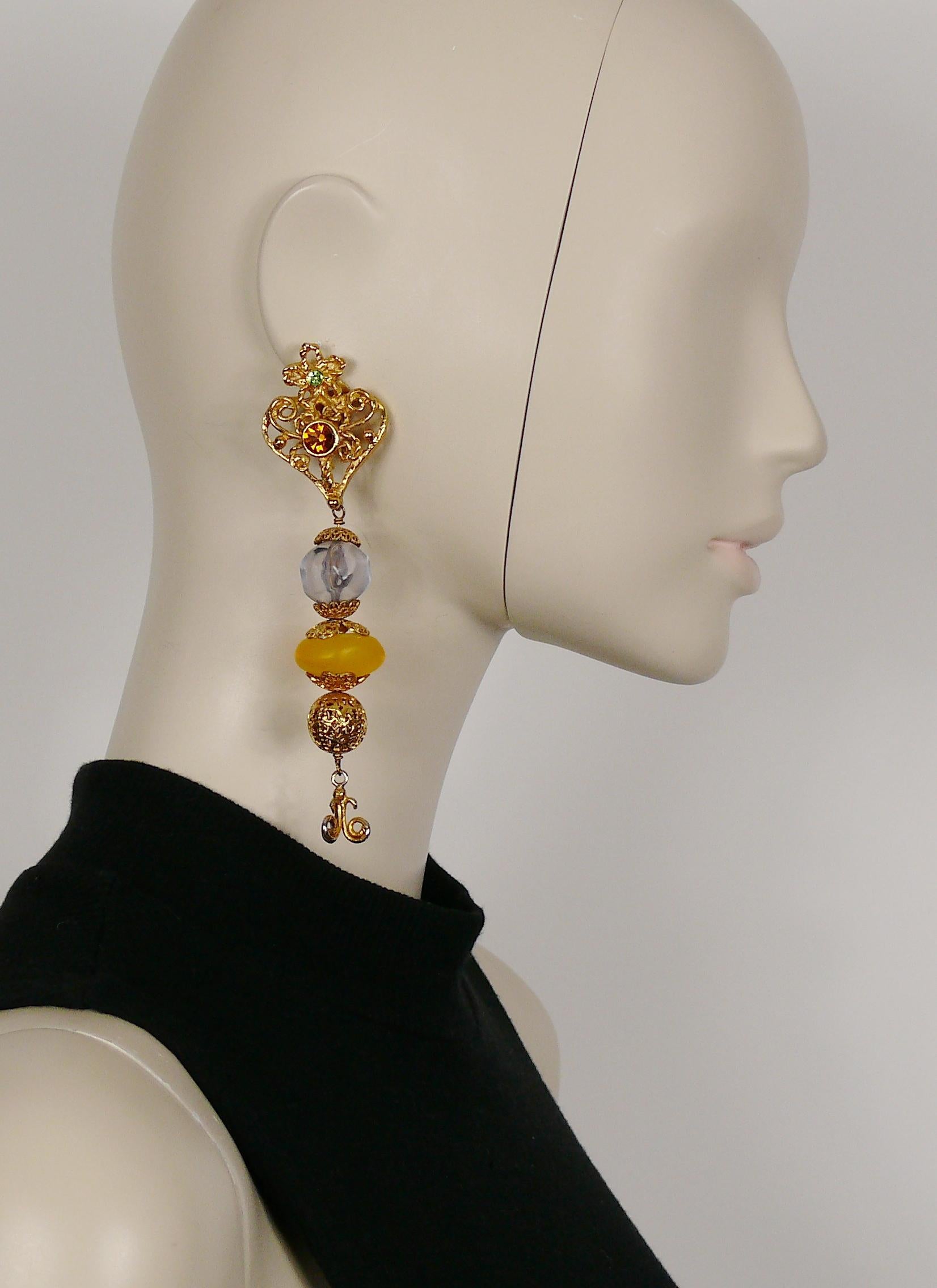 CHRISTIAN LACROIX vintage extra long gold toned dangling earrings (clip-on) featuring an openwork heart embellished with multicolor crystals and large resin beads.

Marked CHRISTIAN LACROIX CL Made in France.

Indicative measurements : height