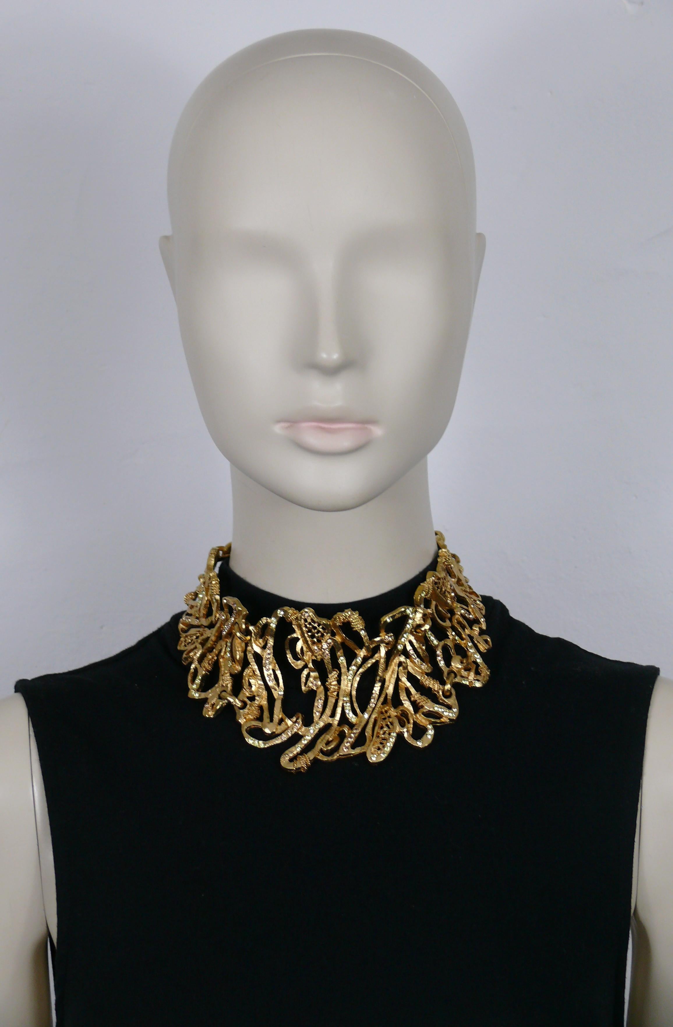CHRISTIAN LACROIX vintage opulent gold tone chocker necklace featuring an intricate openwork design embellished with jonquil and amber colour crystals.

Adjustable T-bar and toggle closure.

Marked CHRISTIAN LACROIX CL Made in France.

Indicative