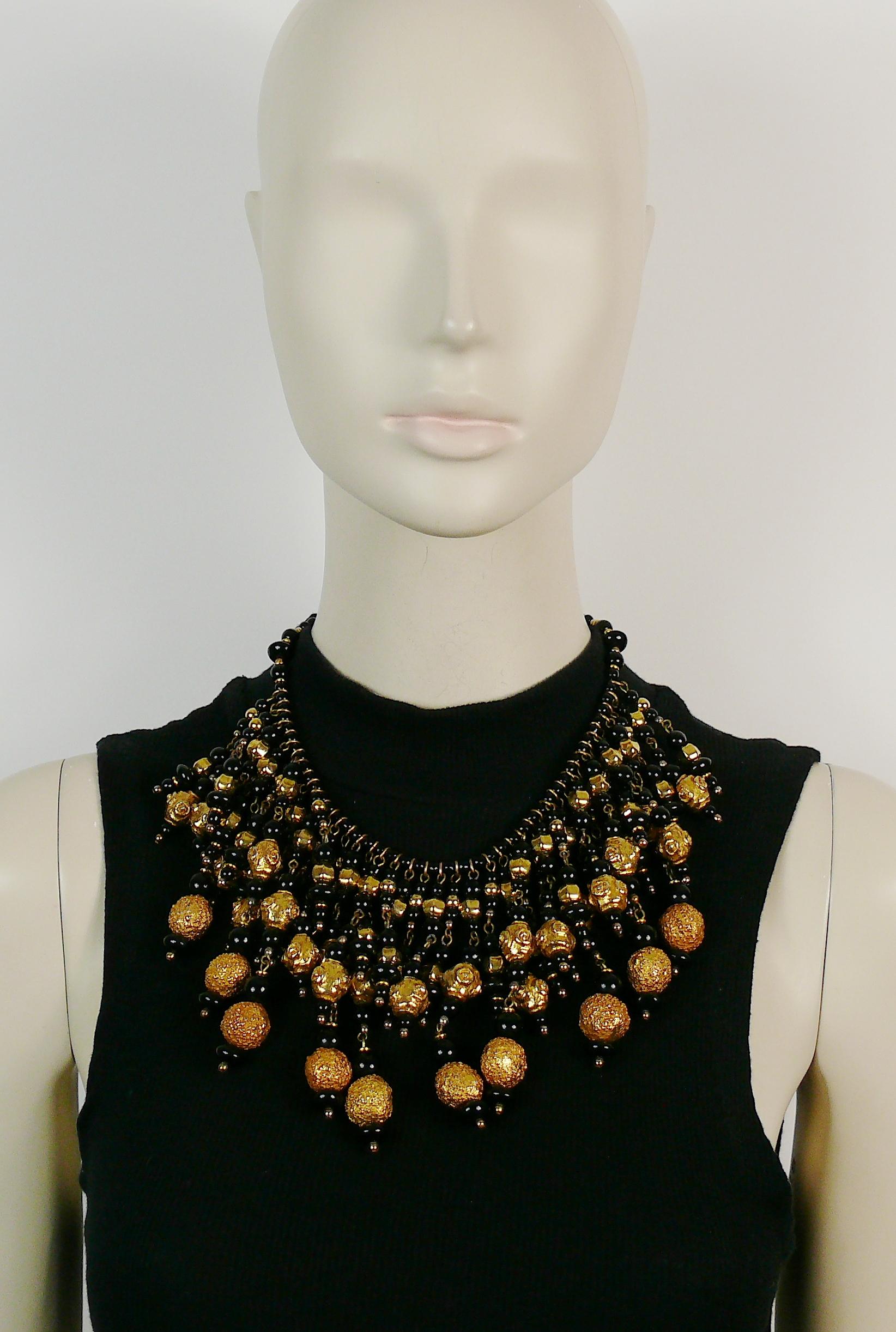 CHRISTIAN LACROIX vintage runway bib necklace featuring graduated black glass beads and textured gold toned balls.

Lobster clasp closure.

Embossed CHRISTIAN LACROIX CL Made in France.

Indicative measurements : total length approx. 41.5 cm (16.34