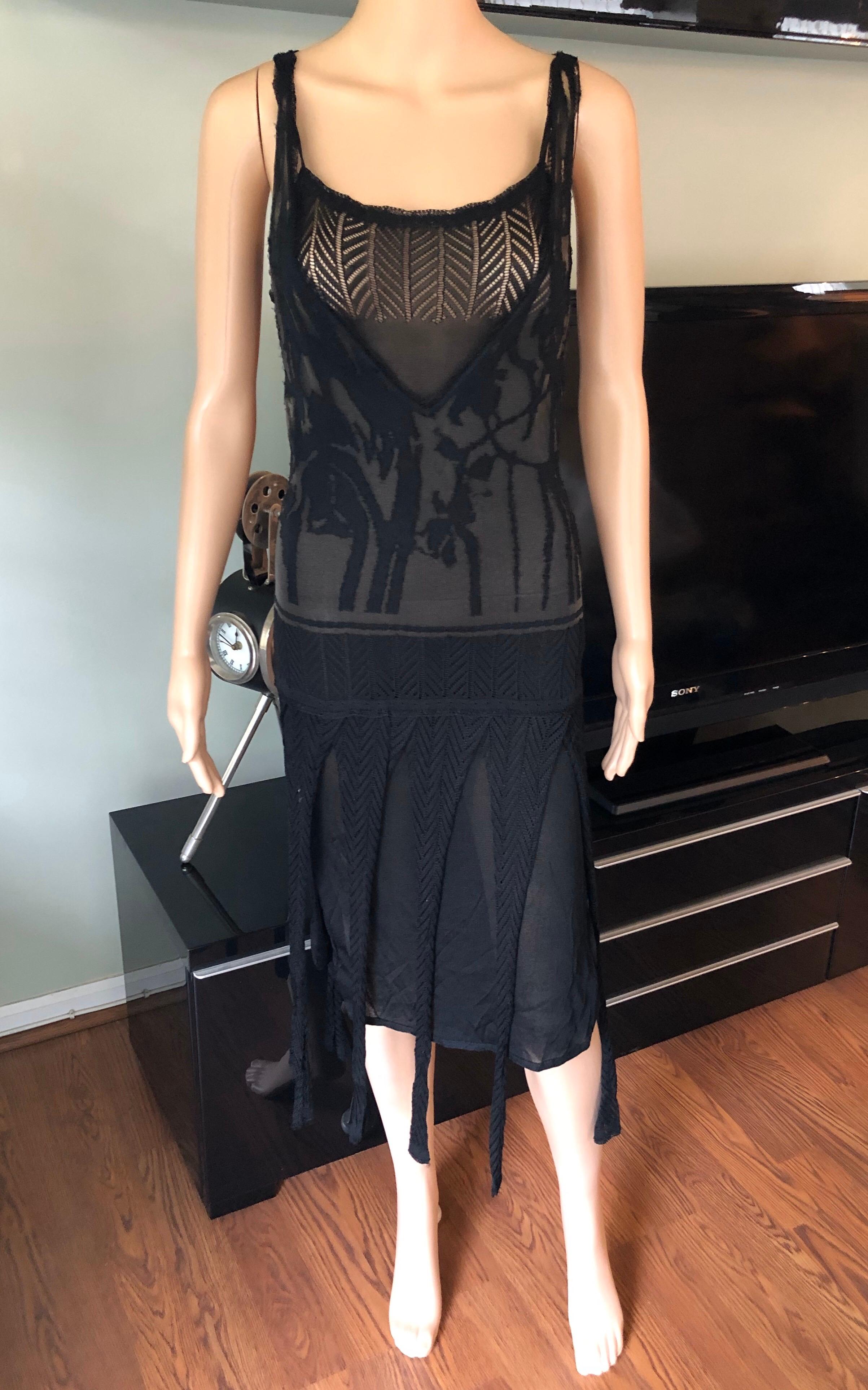 Christian Lacroix Vintage Semi-Sheer Crochet Mesh Knit Fringed Black Dress M

Christian Lacroix  2 Piece knit dress with sheer plunging neckline, fringed trims and dual vents at hem.

