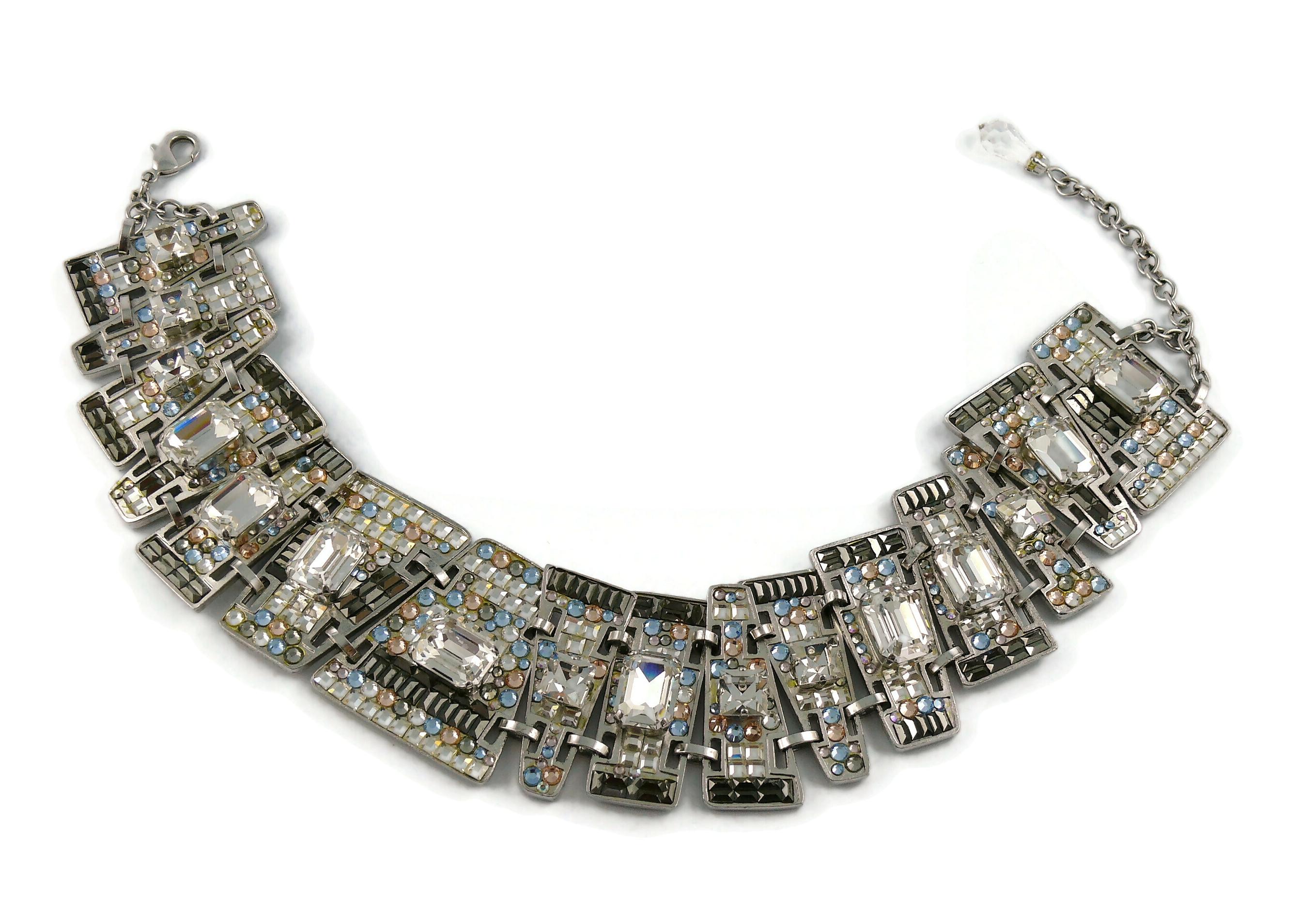 CHRISTIAN LACROIX vintage silver toned articulated choker necklace embellished with multicolored crystals (clear, grey, pink, blue).

Silver tone metal hardware.

Adjustable lobster clasp closure.

Marked CHRISTIAN LACROIX CL Made in