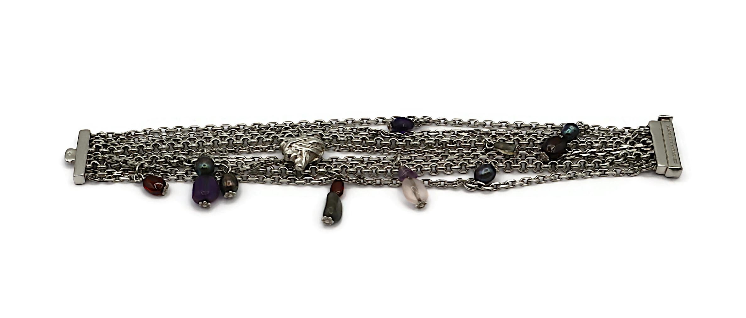 CHRISTIAN LACROIX vintage sterling silver multi-strand chain bracelet, adorned with multicolored stones, iridescent beads, and a stylized heart charm.

Embossed CHRISTIAN LACROIX on the clasp.
Embossed with the French silver Minerve hallmark, a