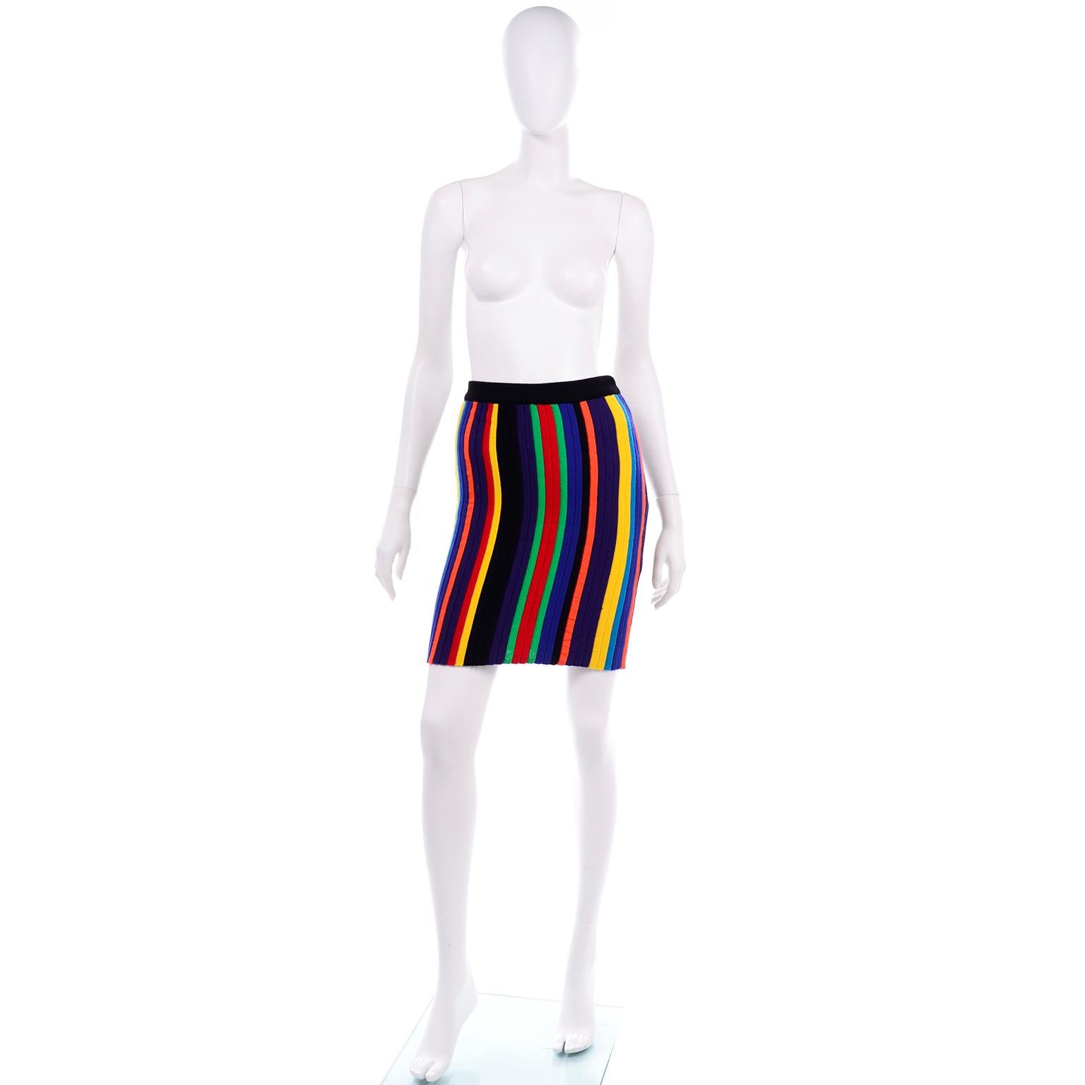 We absolutely adore this colorful striped wool mini skirt by the amazing Christian Lacroix. This gorgeous knit mini skirt has green, red, royal blue, black, orange, purple, yellow, and turquoise vertical stripes. The waistband is elastic and black