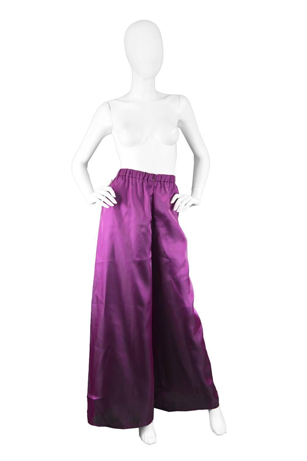Christian Lacroix Vintage Wide Leg Irridescent Purple Palazzo Pants, 1990s

Size: Marked EU 42 which is roughly a UK 14/ US 10. Please check measurements
Waist - 30-32” / 76-81cm
Hips - Up to 48” / 122cm
Rise - 15” / 38cm
Inside Leg - 31” /