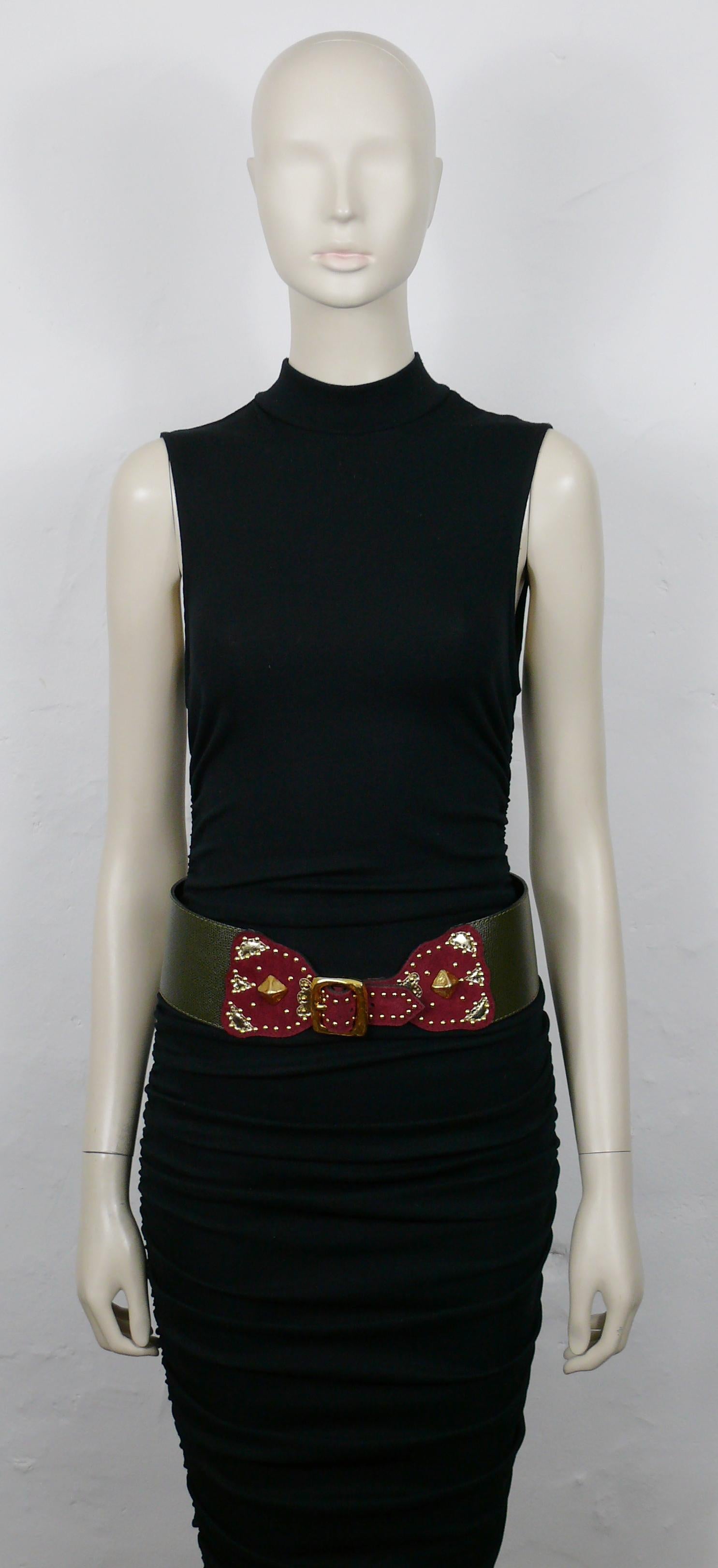 CHRISTIAN LACROIX vintage wide khaki color grained leather belt with burgundy red suede details, gold leather appliques, metal studs, gold resin pyramidal cabochons, textured gold tone metal buckle.

Marked CHRISTIAN LACROIX Paris.
Made in