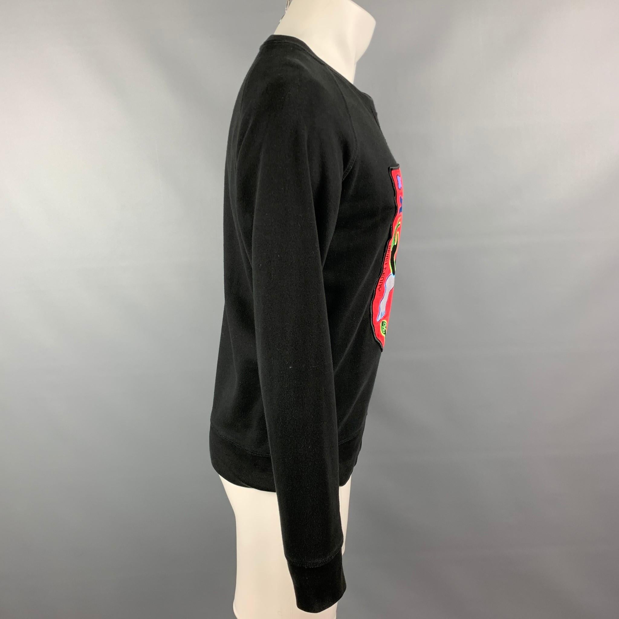 CHRISTIAN LACROIX x BRIAN KENNY Limited Edition sweatshirt comes in a black & red abstract cotton featuring a large patch detain and a crew-neck.

Good Pre-Owned Condition.
Marked: S

Measurements:

Shoulder: 17 in.
Chest: 41 in.
Sleeve: 26.5