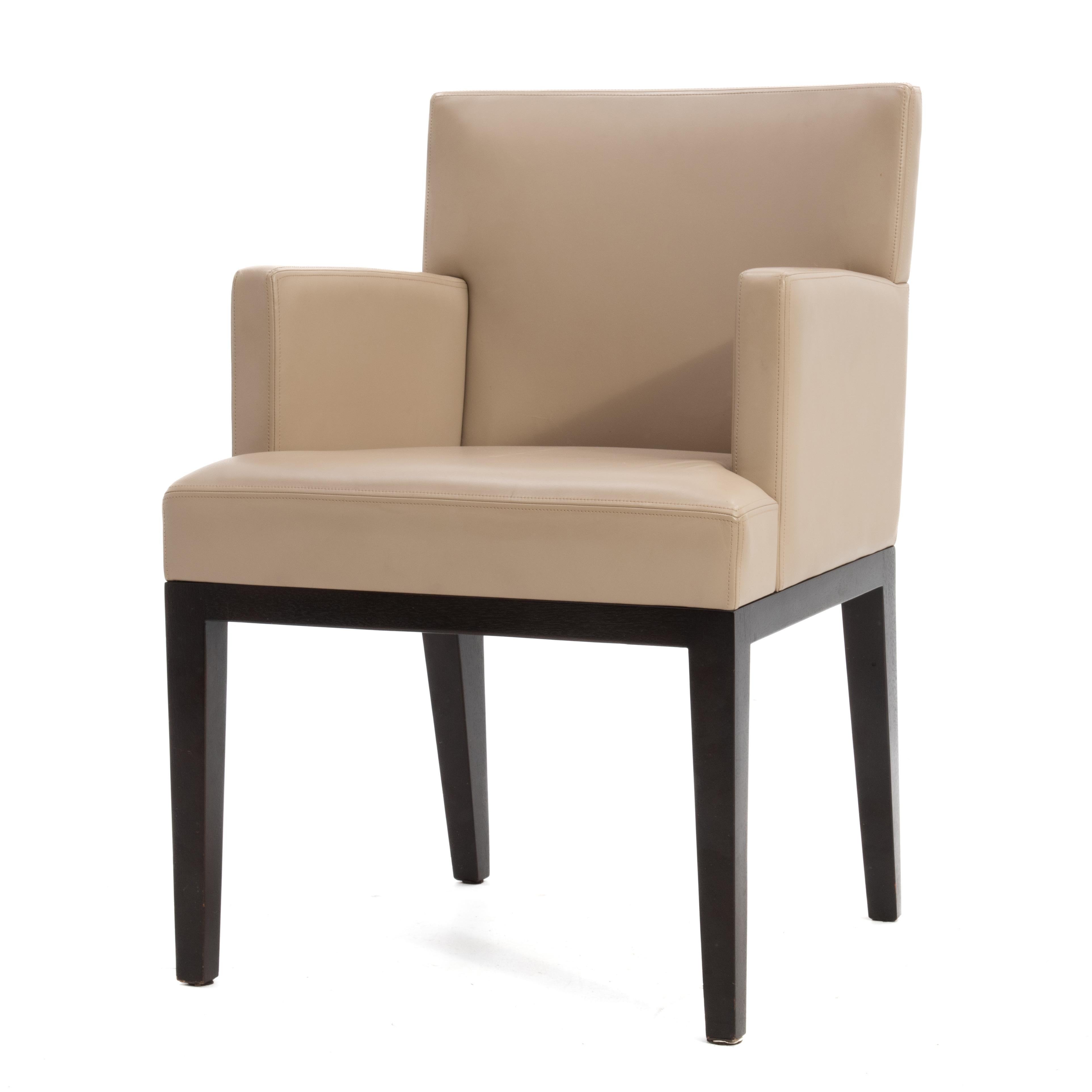 A leather side chair by Christian Liaigre at Holly Hunt. Beige leather with an ebonized wood frame.
Christian Liaigre attended the Ecole Des Beaux-Arts in Paris and is known for his equestrian influenced, high quality craftsmanship, and the relaxed,