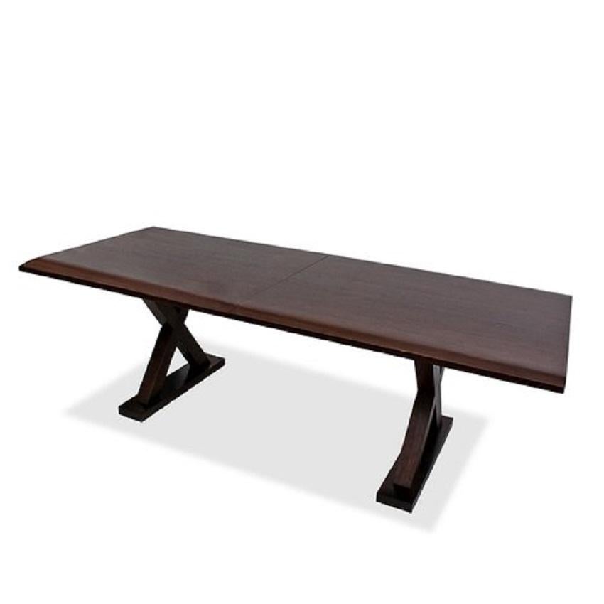 A wood trestle dining table by Christian Liaigre for Holly Hunt Courier Dining Table. 

Circa 2010.

Recently restored/refinished.

Includes one 20 inch leaf (not shown).

Dimensions with leaf: 110 L x39.5 D x28.75 H inches
Dimensions without leaf: