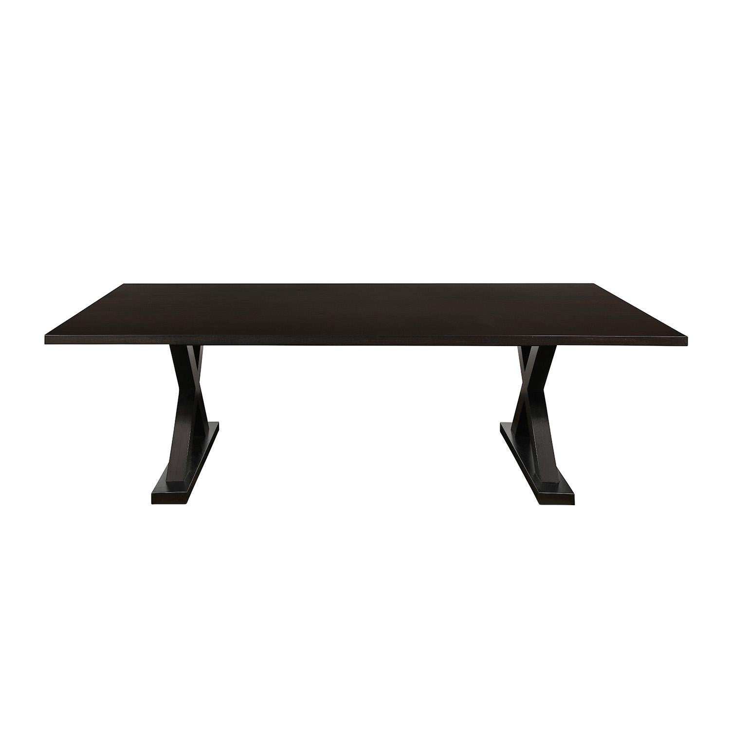 Long Courier dining table in dark oak with X base by Christian Liaigre and sold through Holly Hunt, American 2000's (label on the bottom reads “CHRISTIAN LIAIGRE AT HOLLY HUNT”). This table is a timeless classic.
