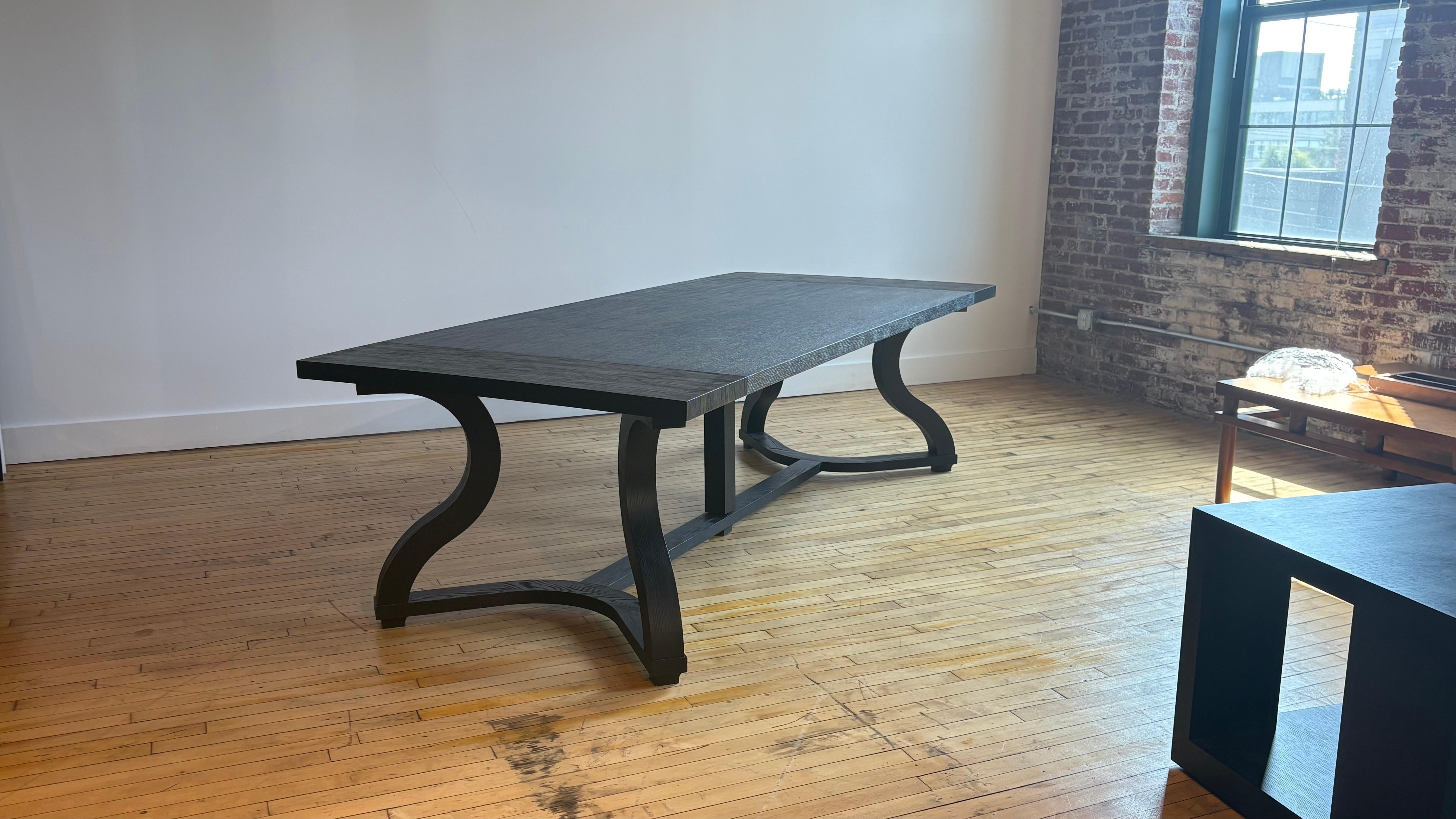 Beautiful Liaigre black oak dining table, circa 2012. Originally from NYC Liaigre showroom for around $25,000. 

Good vintage condition with minor imperfections. 

We have the Liaigre Velin leather banquette and four leather Liaigre Velin chairs