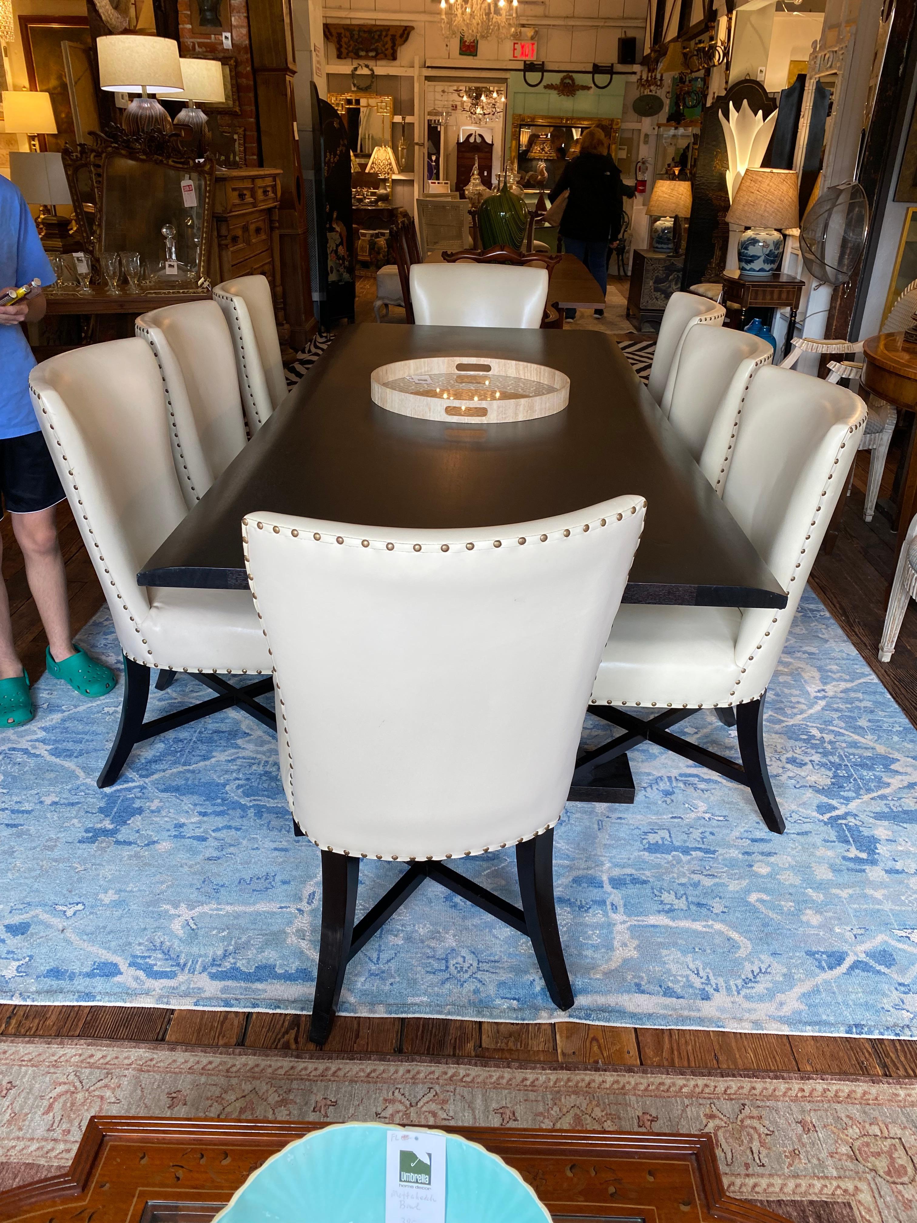 Showstopper ebonized oak Long Courrier table by Christian Liaigre. 
Ebonized oak top featuring unique curved edges, boasting striking wood veins on a trestle X-leg frame base. 

