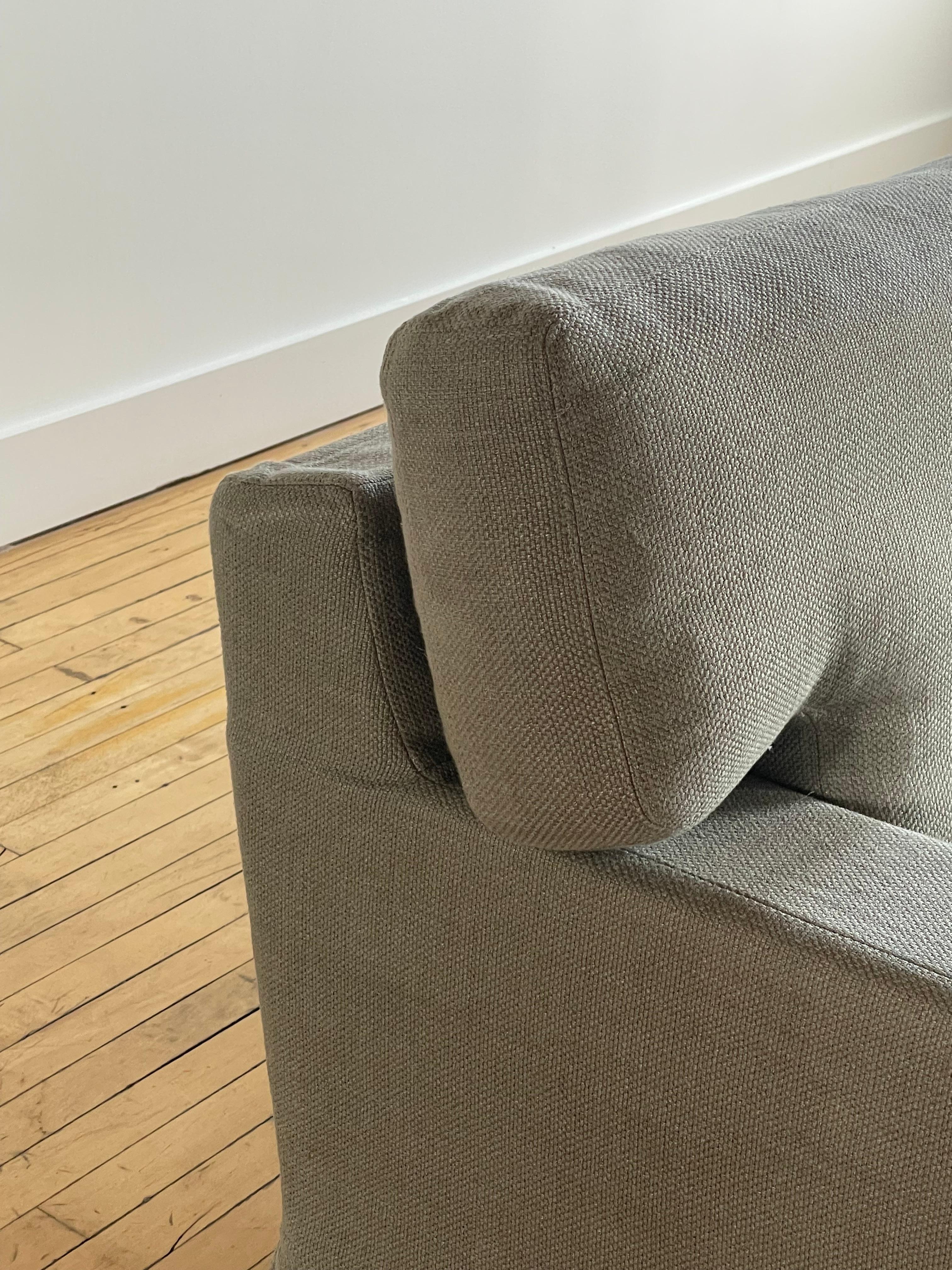 Beautiful Christian Liaigre Sofa in light grey fabric—likely a high performance cotton blend. 

This sofa strikes a perfect balance between comfort and style. It’s not  too deep and not too upright. 

Unknown model number, likely from 2008-2010.