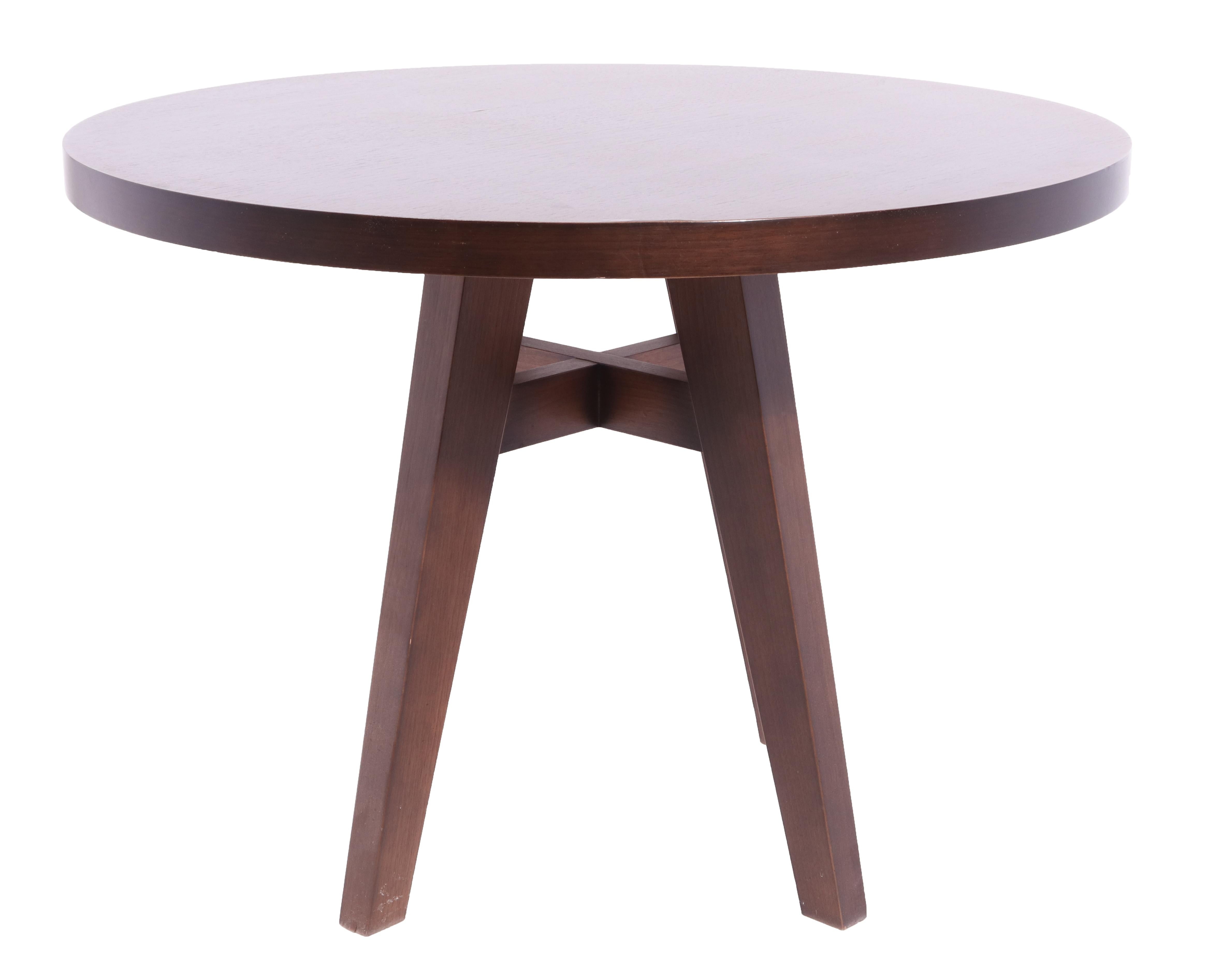 Christian Liaigre style modern round top wood occasional table or center table with splay leg base. Measures: 25.75