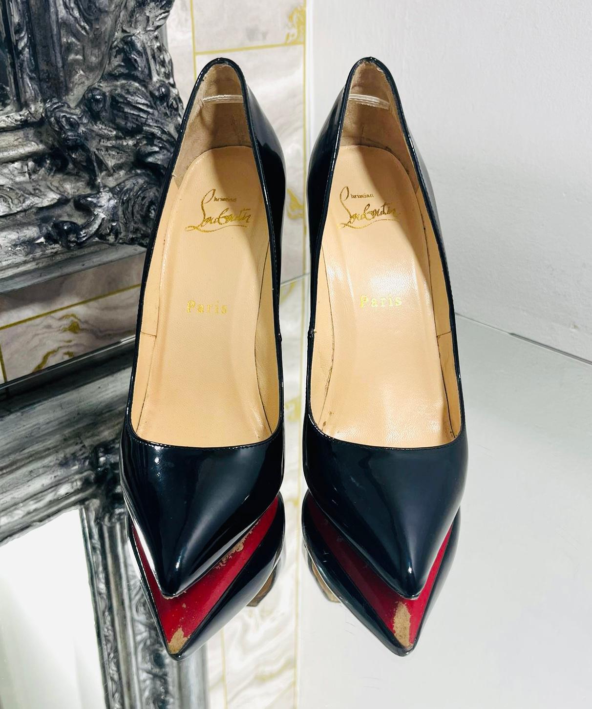 Christian Louboutin 100 Patent Leather Heels

Classic, black heels designed with pointed toe and stiletto heel.

Detailed with iconic red soles and leather lining.

Size – 35

Condition – Very Good

Composition – Patent Leather
