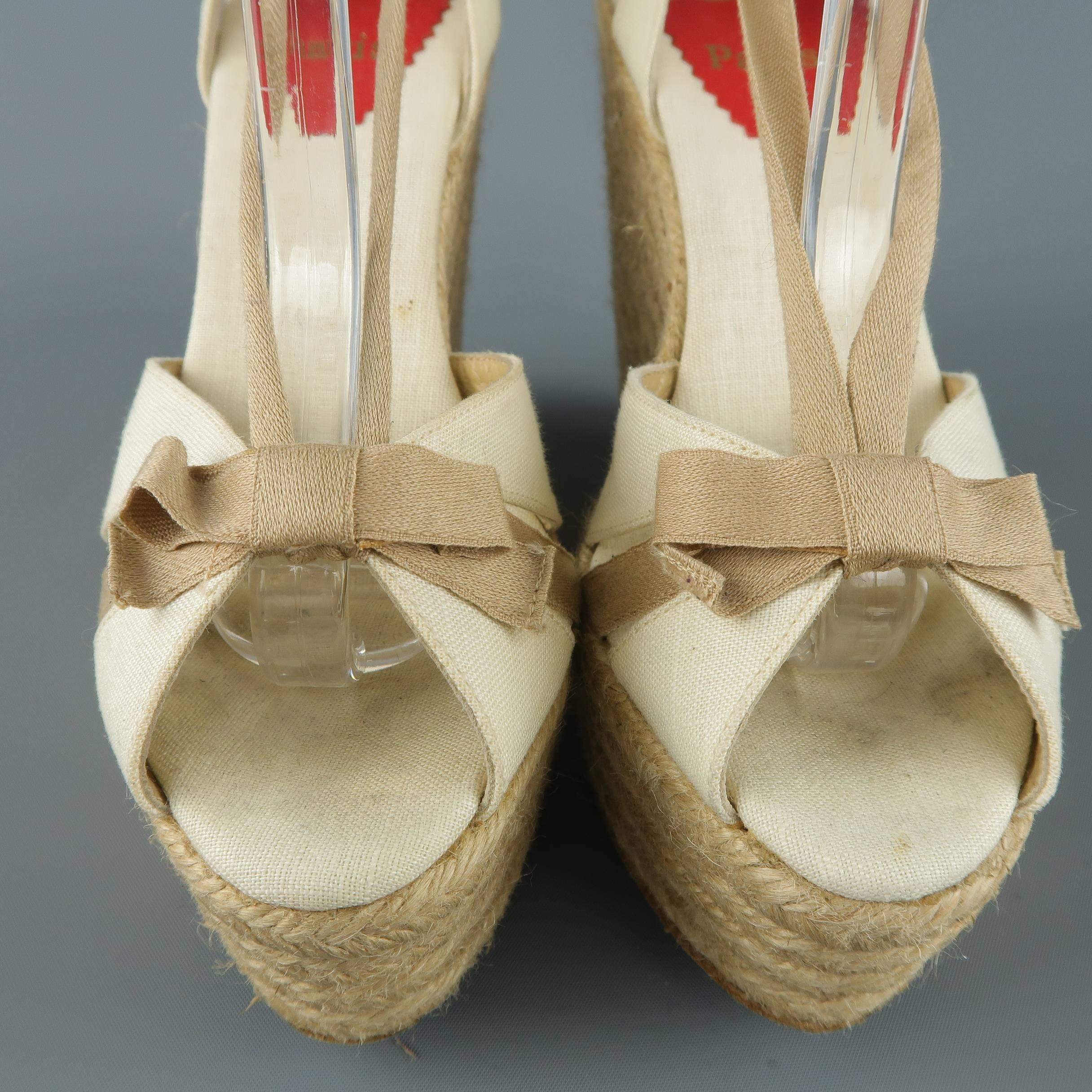CHRISTIAN LOUBOUTIN sandals come in cream and beige fabric with a bow detailed peep toe, sling back, tied ankle strap, and woven espadrille platform wedge. Resoled.
 
Good Pre-Owned Condition.
Marked: (no size)
 
Measurements:
 
Heel: 5