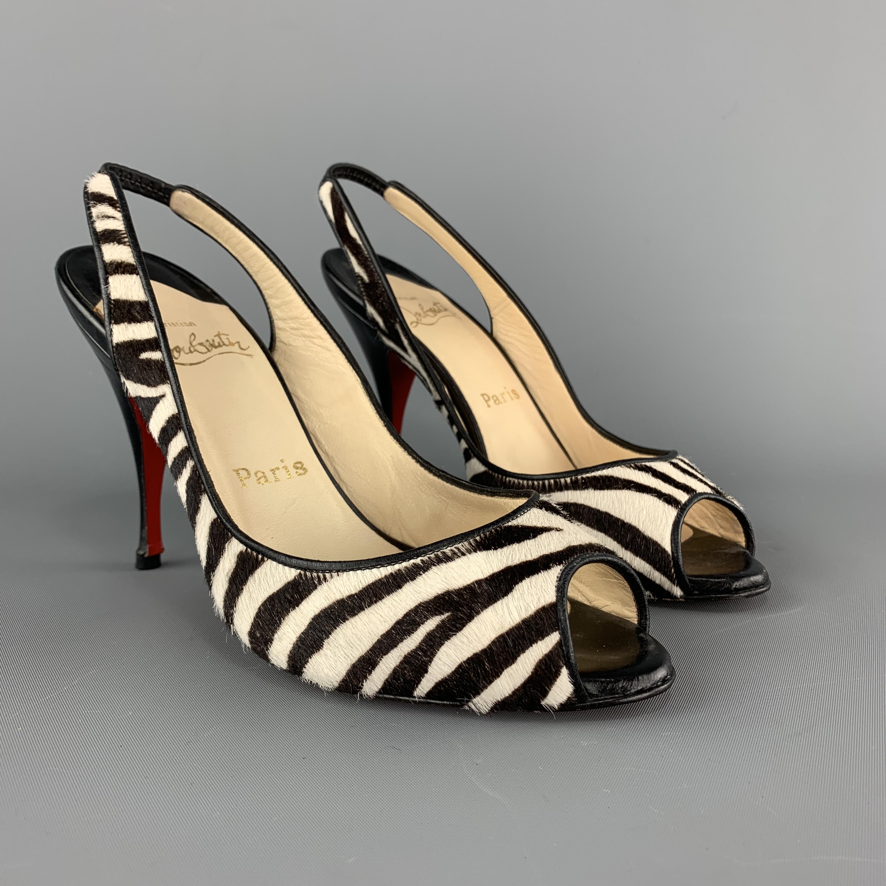 CHRISTIAN LOUBOUTIN pumps come in black and white zebra print calf hair leather with a sling back, peep toe, and tapered heel. Made in Italy.

Good Pre-Owned Condition.
Marked: IT 37

Heel: 4.25 in.