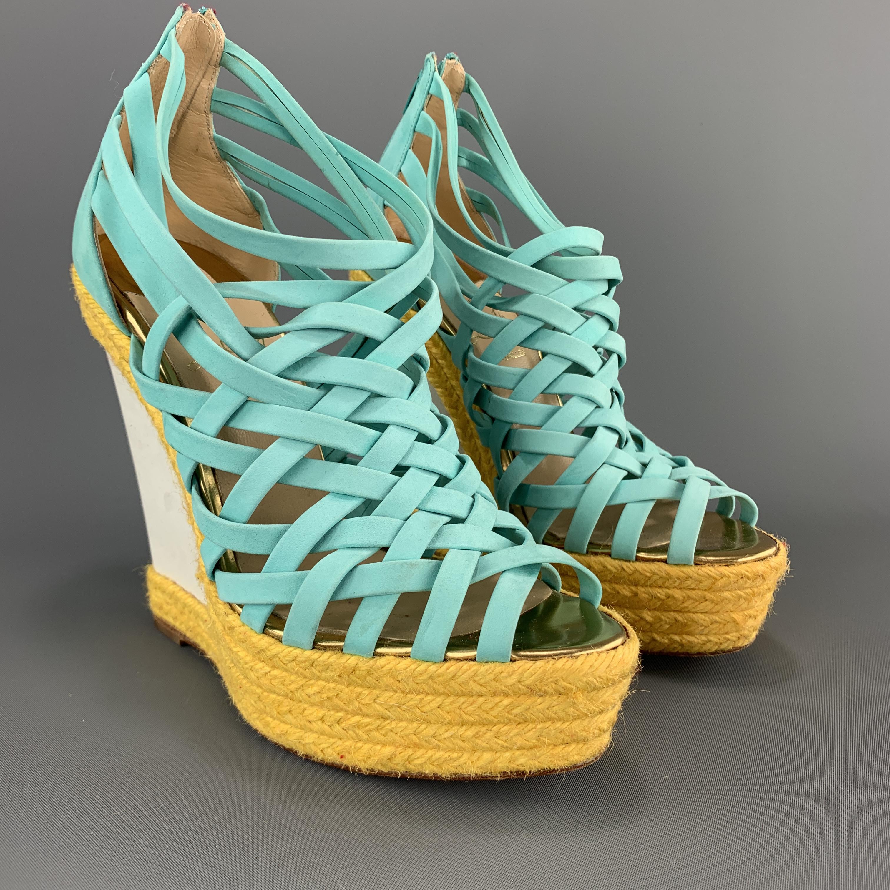 CHRISTIAN LOUBOUTIN espadrille wedges feature turquoise suede woven straps with a white suede platform wedge detailed with yellow braid trim. Made in Spain.

Excellent Pre-Owned Condition.
Marked: IT 37

Measurements:

Heel: 5.5 in.
Platform: 1.25