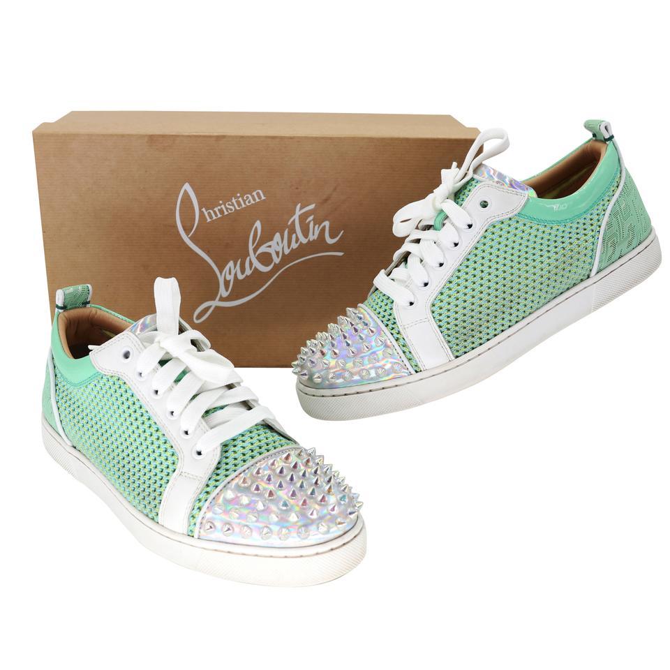 Christian Louboutin creates another iconic sneaker inspired by '80s tennis shoes, these Louis Junior Spikes Orlato sneakers are crafted of perforated calfskin leather with a contrast heel and toe box embellished with the brand's signature spikes.